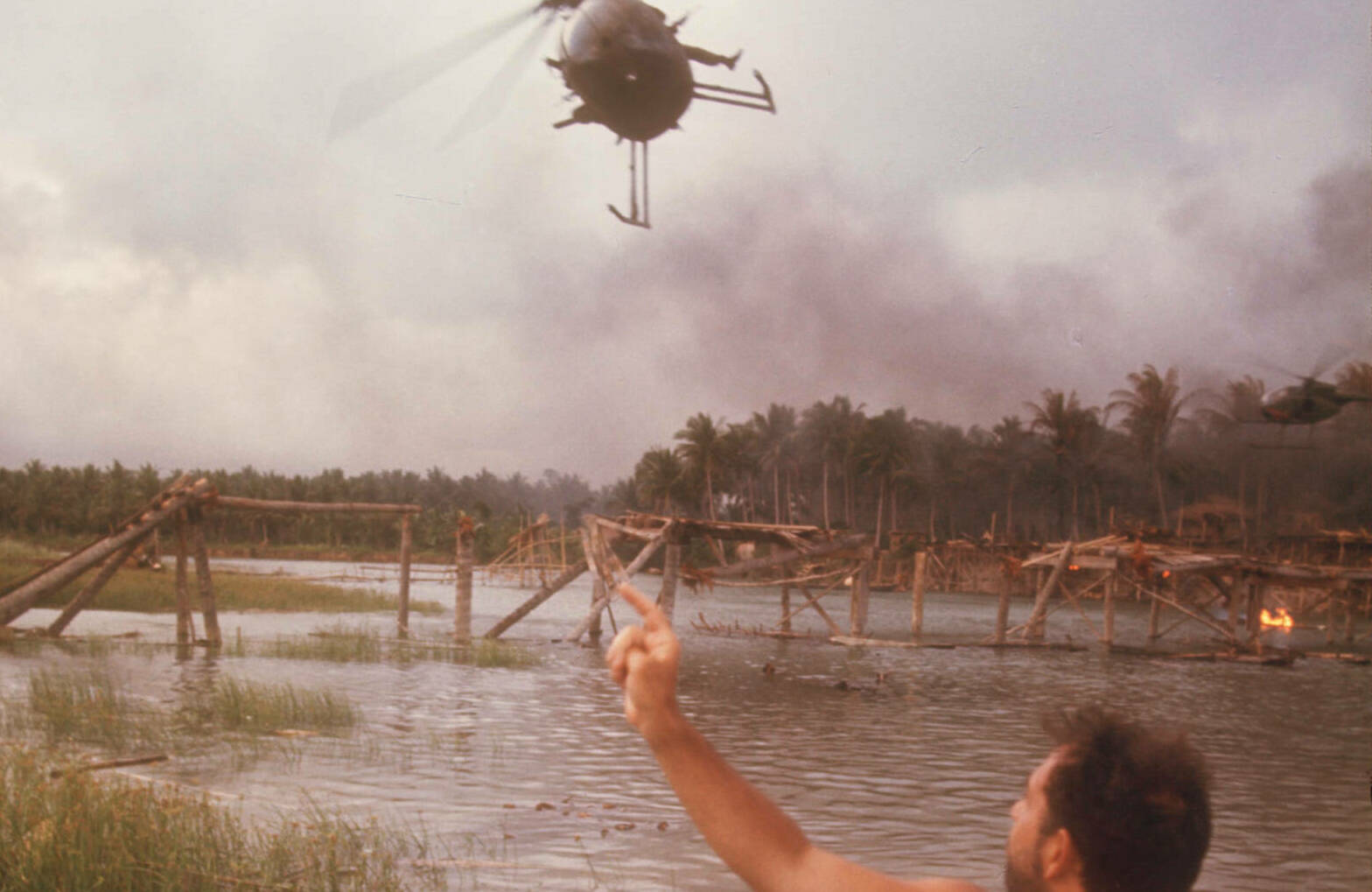 25412 03: Director Francis Ford Coppola directs a helicopter to the right location April 28, 1976 during the filming of 'A...