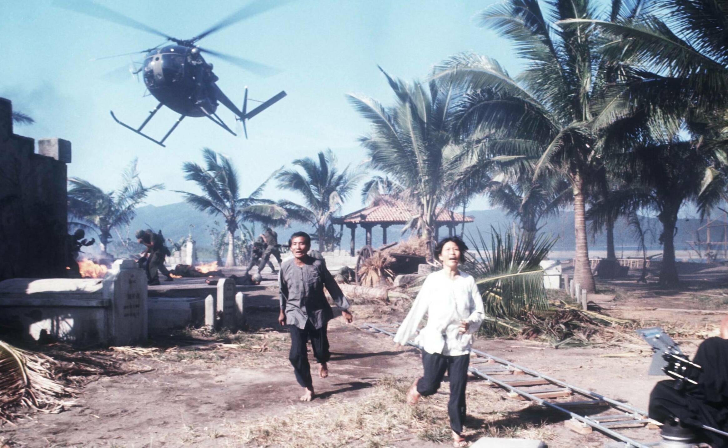 25412 04: Two unidentified actors run April 28, 1976 during the filming of 'Apocalypse Now' in the Philippines. The movie ...
