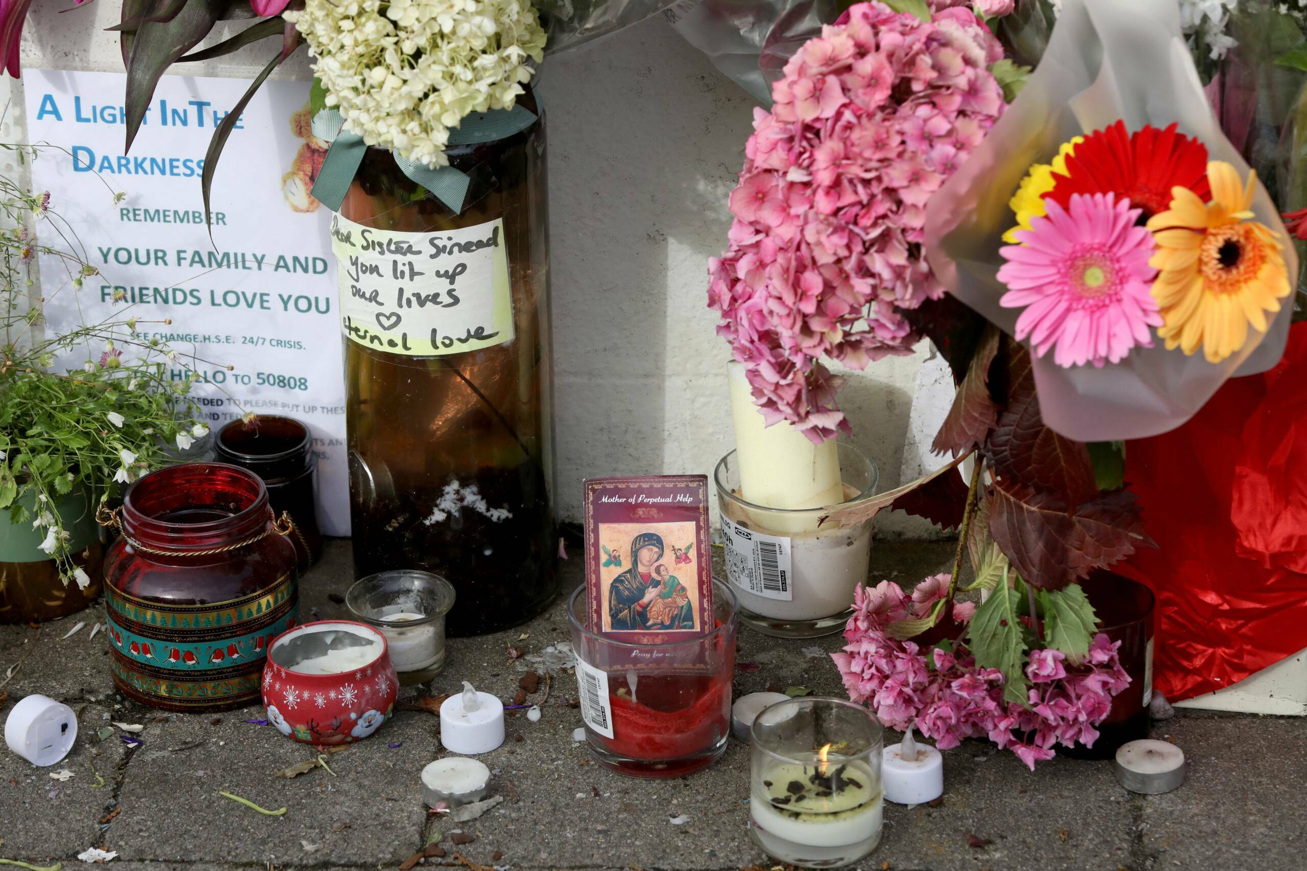 Flowers and tributes are pictured outside the former home of Irish singer Sinead O'Connor, in Bray, eastern Ireland, ahead...