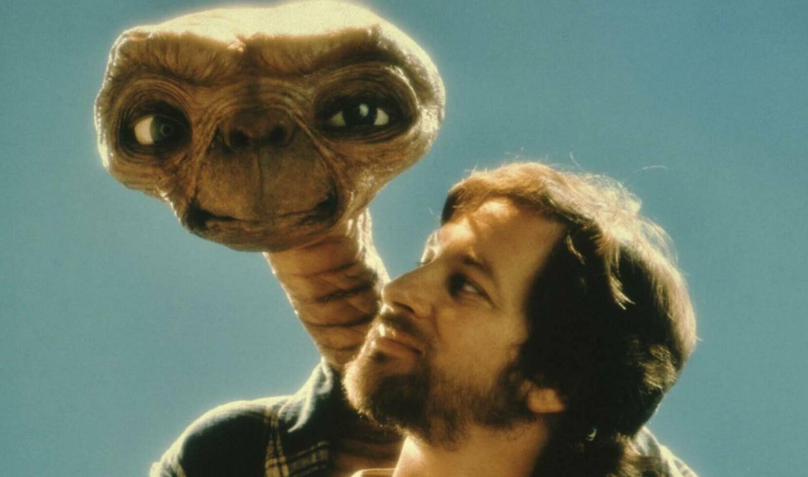 Steven Spielberg poses with E.T. at Carlo Rimbaldi studio in April, 1982 in Los Angeles, California.  (Photo by Mark Senne...
