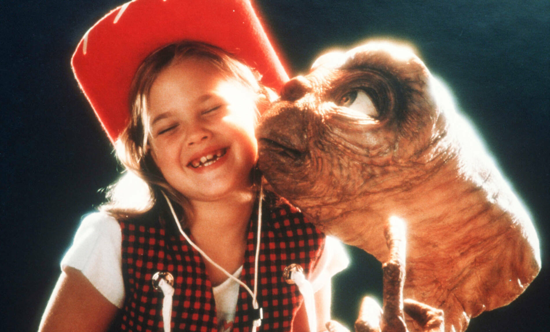 Actress Drew Barrymore poses with E.T. at Carlo Rimbaldi studio in April, 1982 in Los Angeles, California.  (Photo by Mark...