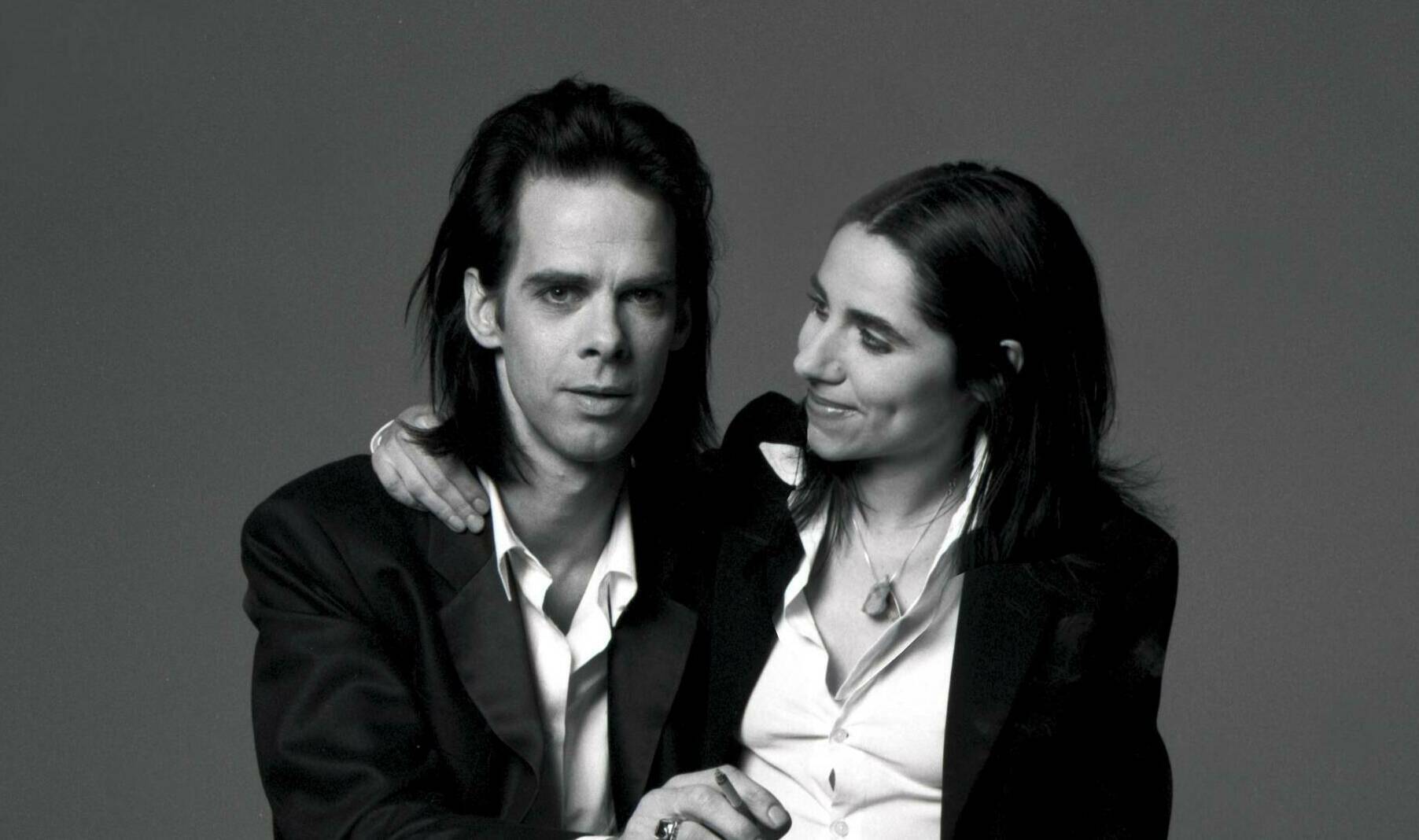 Portrait of Australian singer-songwriter Nick Cave and English singer-songwriter PJ Harvey to promote their duet 'Henry Le...