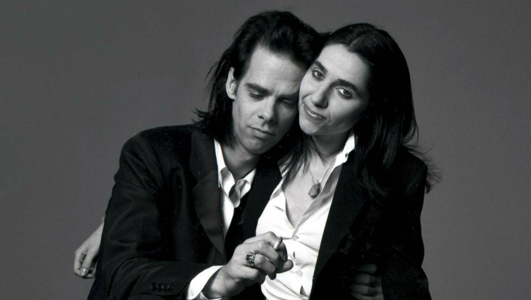 Portrait of Australian singer-songwriter Nick Cave and English singer-songwriter PJ Harvey to promote their duet 'Henry Le...