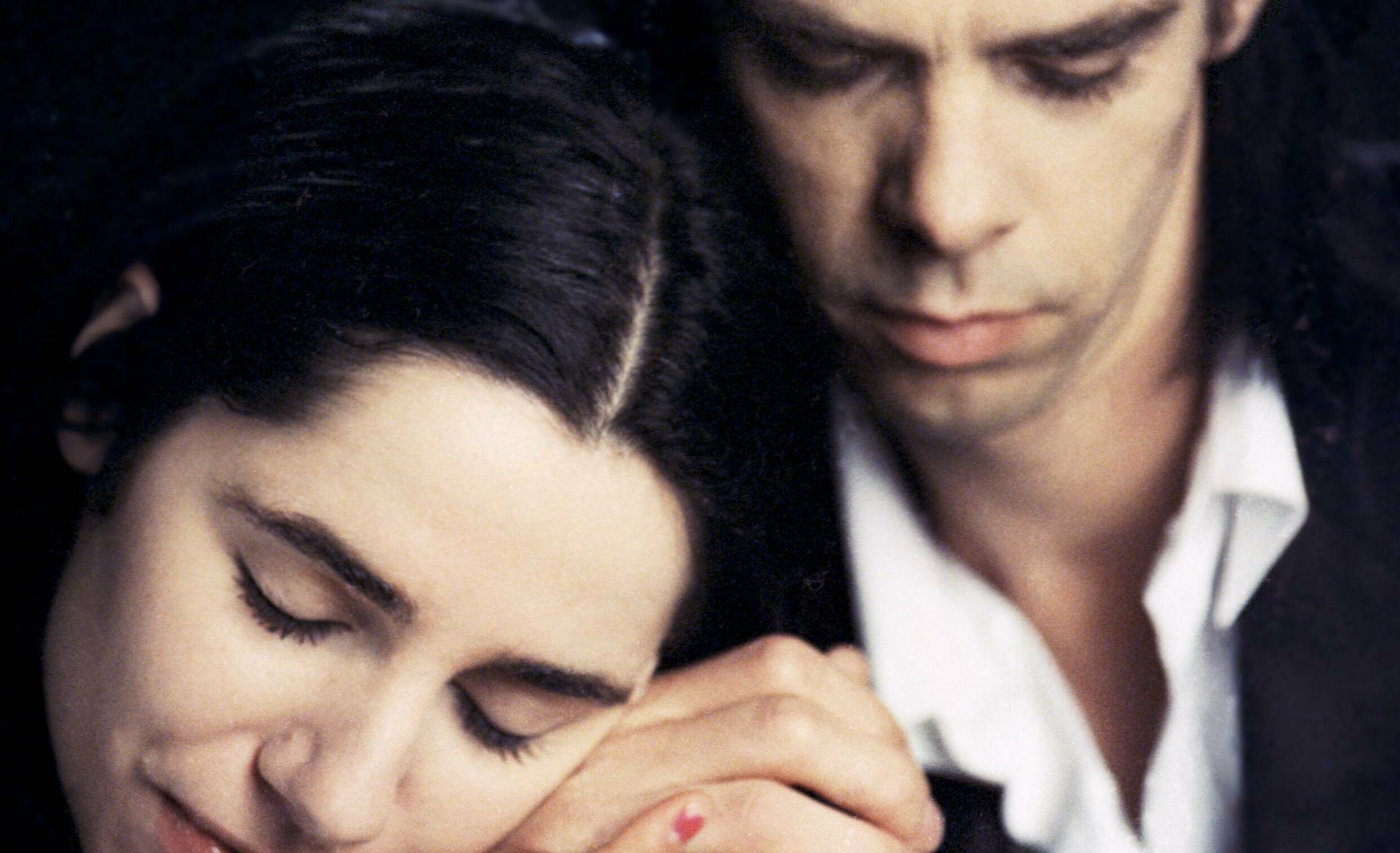 Portrait of Australian singer-songwriter Nick Cave and English singer-songwriter PJ Harvey to promote their duet 'Henry Le...