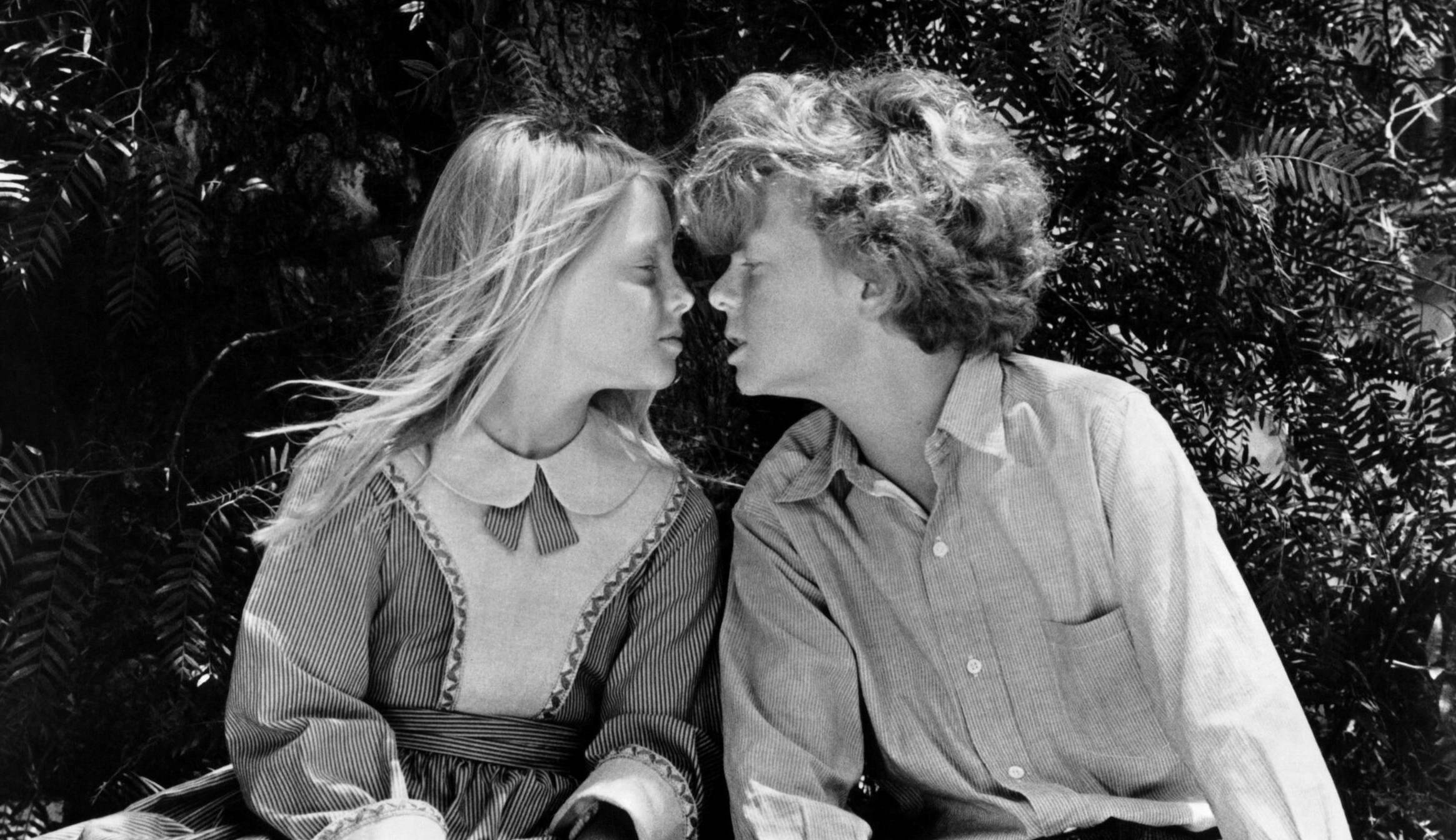 Jodie Foster and Johnny Whitaker about to kiss each other in a scene from the film 'Tom Sawyer', 1973. (Photo by United Ar...