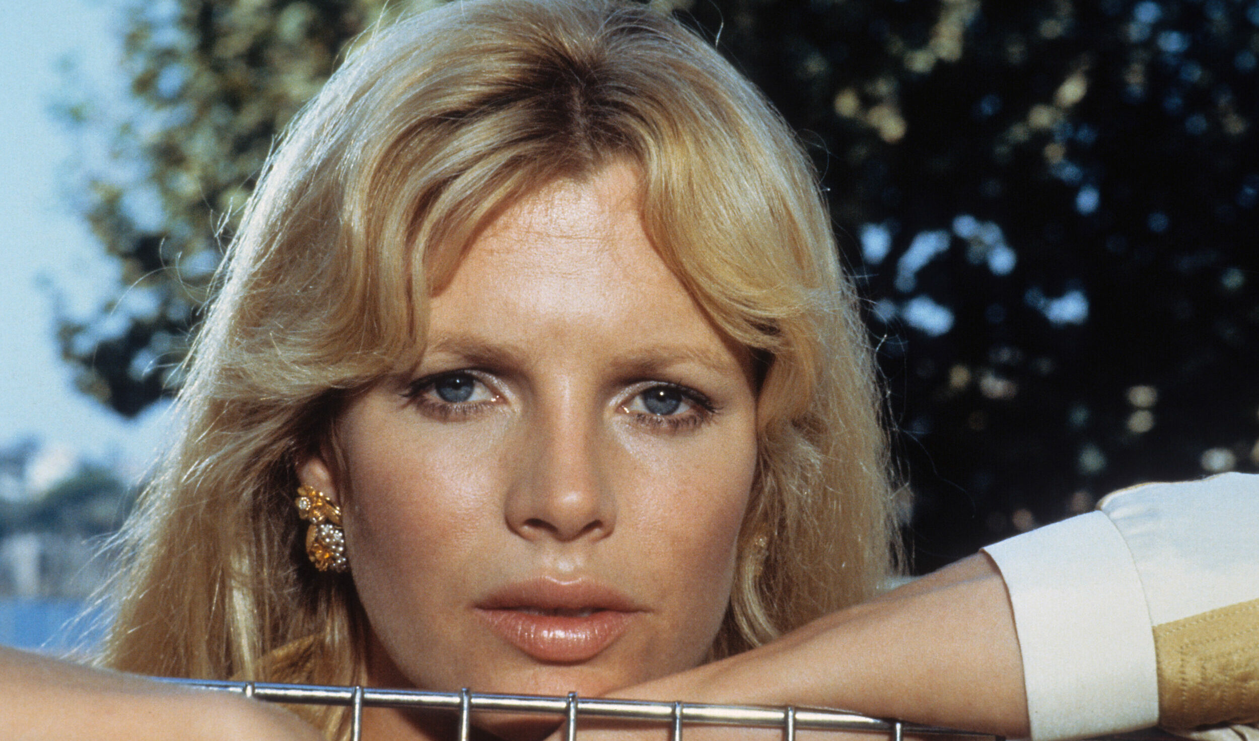 Kim Basinger leaning against top of cage in a scene from the film 'Never Say Never Again', 1983. (Photo by Warner Brothers...