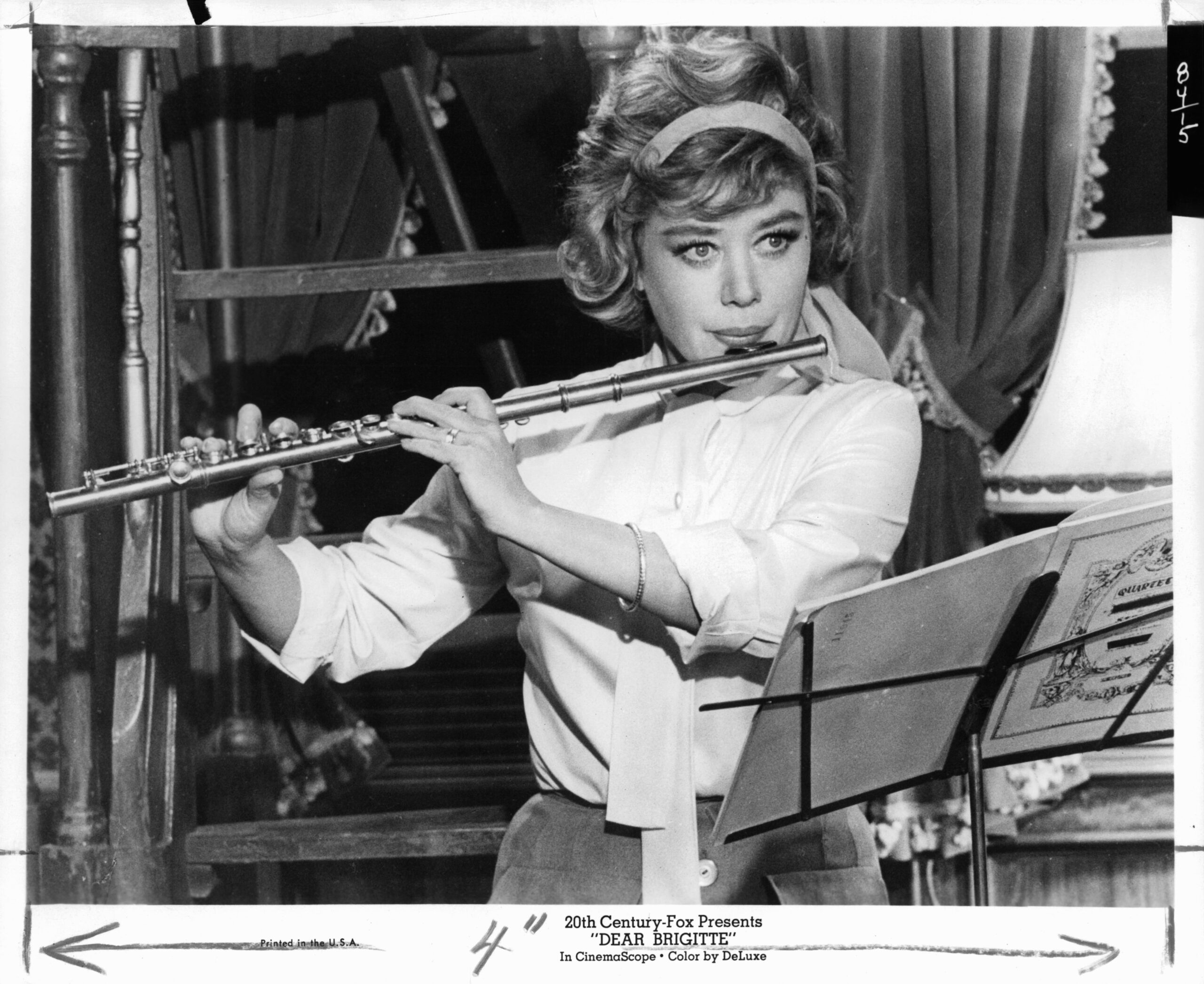 Glynis Johns playing the flute in a scene from the film 'Dear Brigitte', 1965. (Photo by 20th Century-Fox/Getty Images)