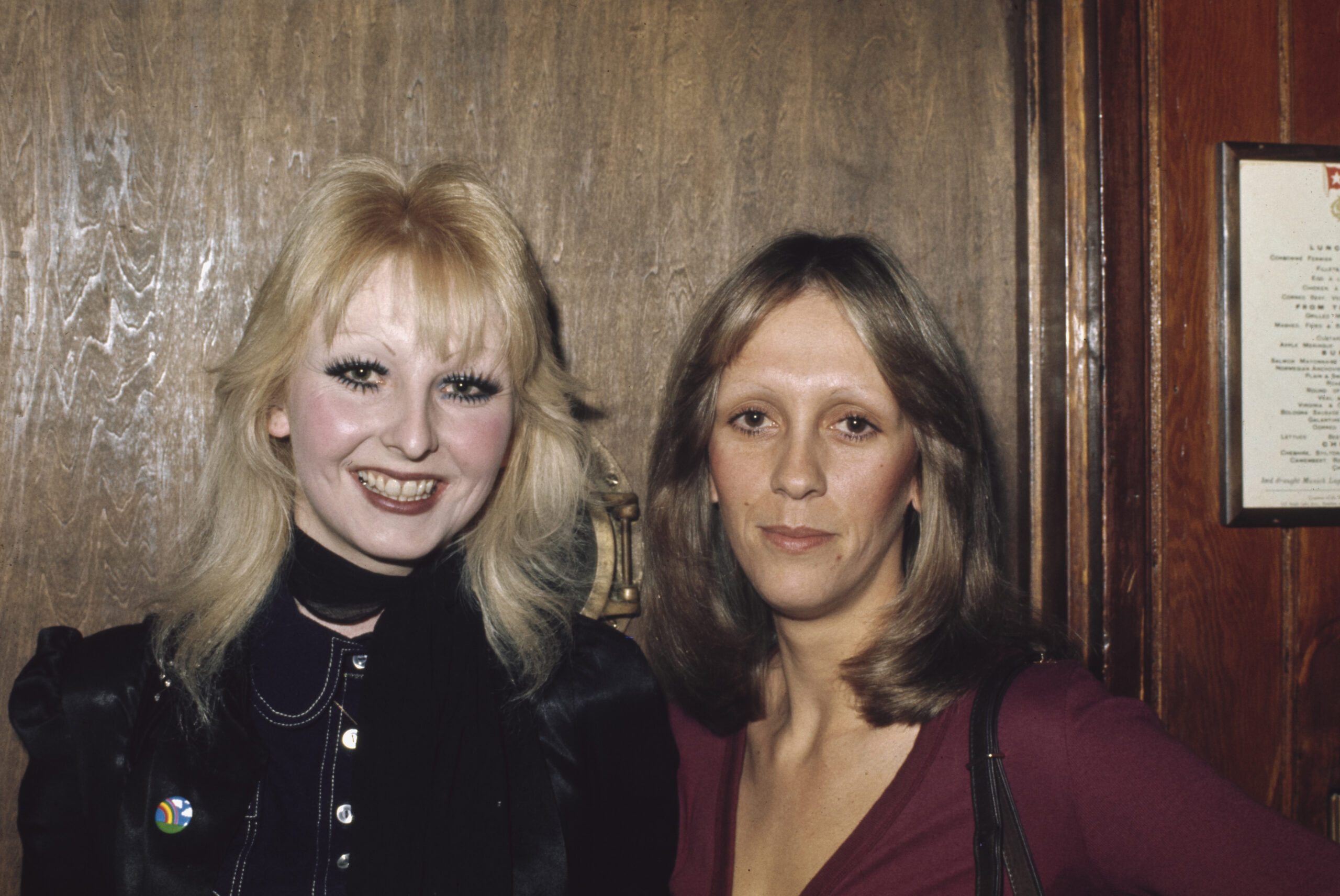 female clubgoers, one wearing a dark blue outfit, the other wearing a deep red outfit, at the Whisky a Go Go, a nightclub ...