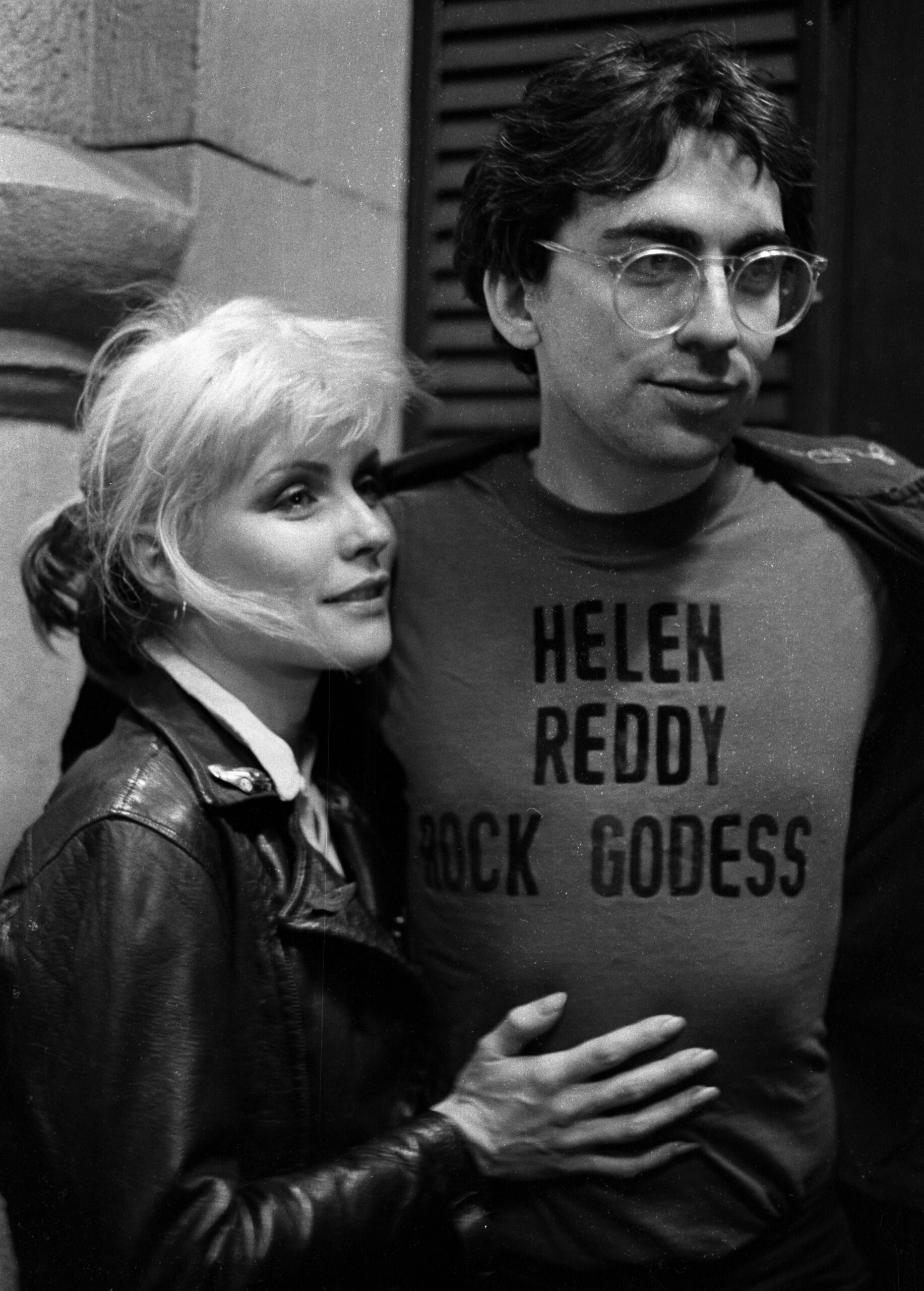 View of American musicians Debbie Harry and Chris Stein, both from the group Blondie, as they stand together backstage at ...