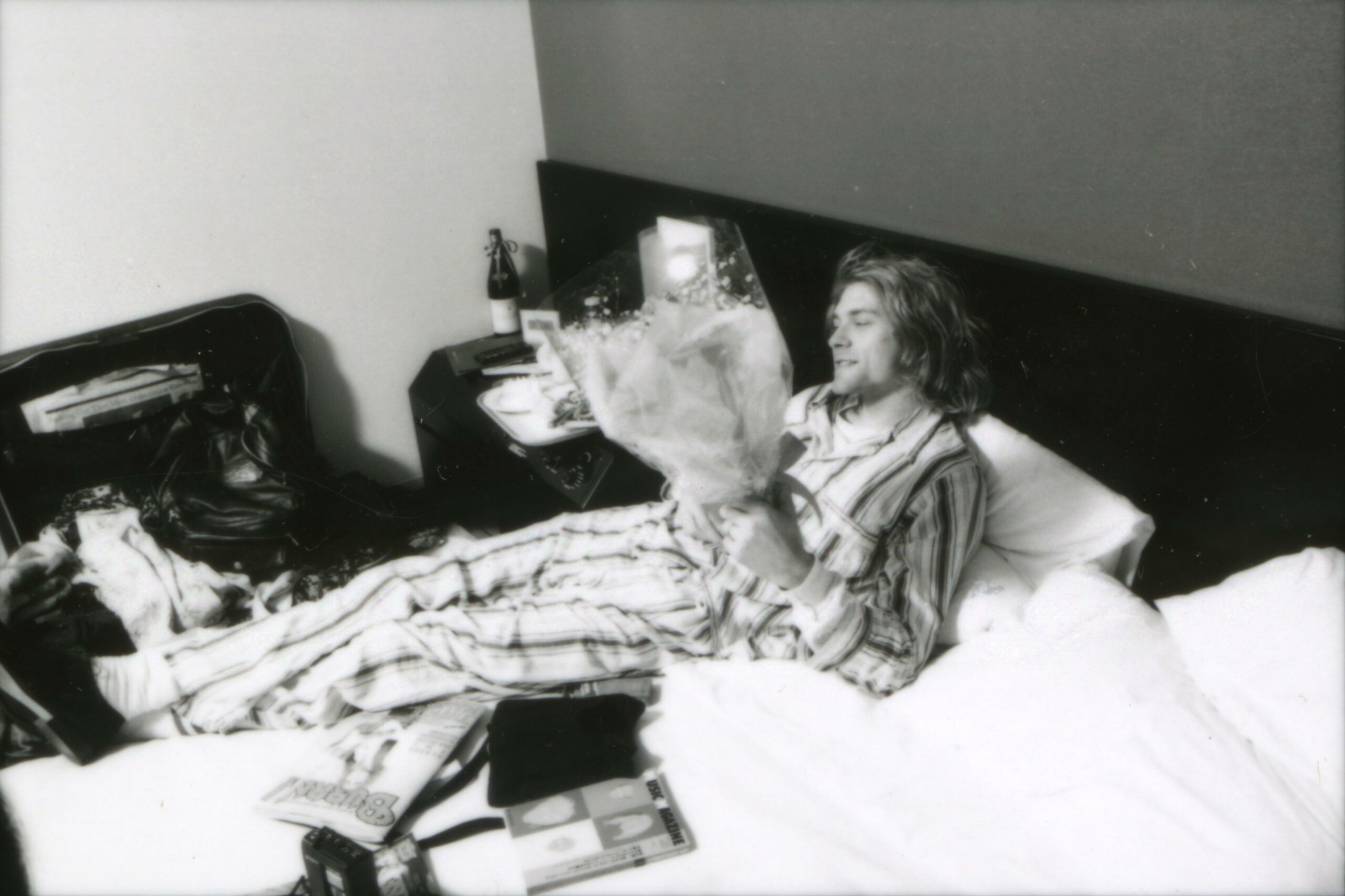 (MANDATORY CREDIT Gutchie Kojima/Shinko Music/Getty Images) Kurt Cobain of Nirvana, lying in bed wearing pyjamas in Roppon...