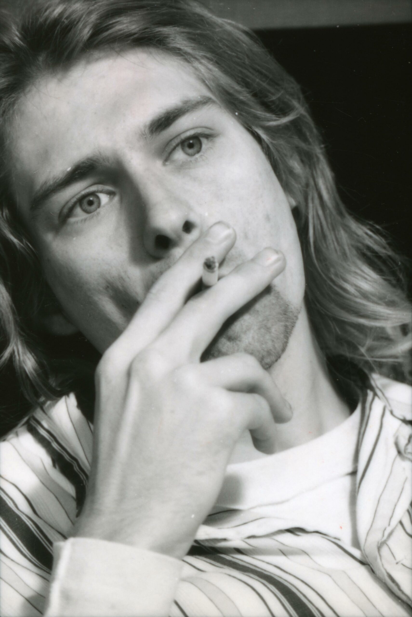 (MANDATORY CREDIT Gutchie Kojima/Shinko Music/Getty Images) Kurt Cobain of Nirvana, lying in bed wearing pyjamas and smoki...