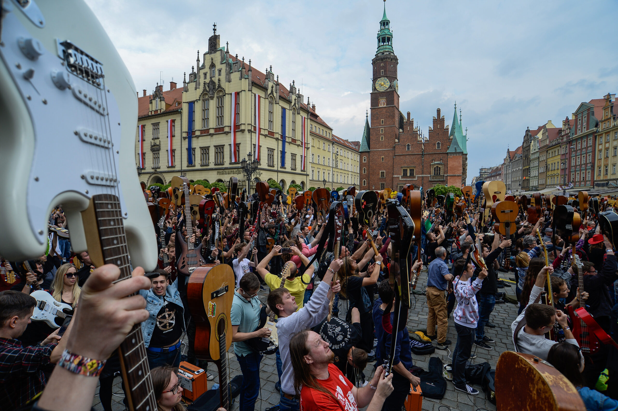 WROCLAW, POLAND - 2019/05/01: A mass gathering of guitarists seen attempting to beat the Guinness record for ensemble guitar playing at the Main Square. According to the organizer, reports say 7243 musicians gathered in Wroclaw Market Square to play Jimi Hendrix's hit 'Hey Joe'. (Photo by Omar Marques/SOPA Images/LightRocket via Getty Images)