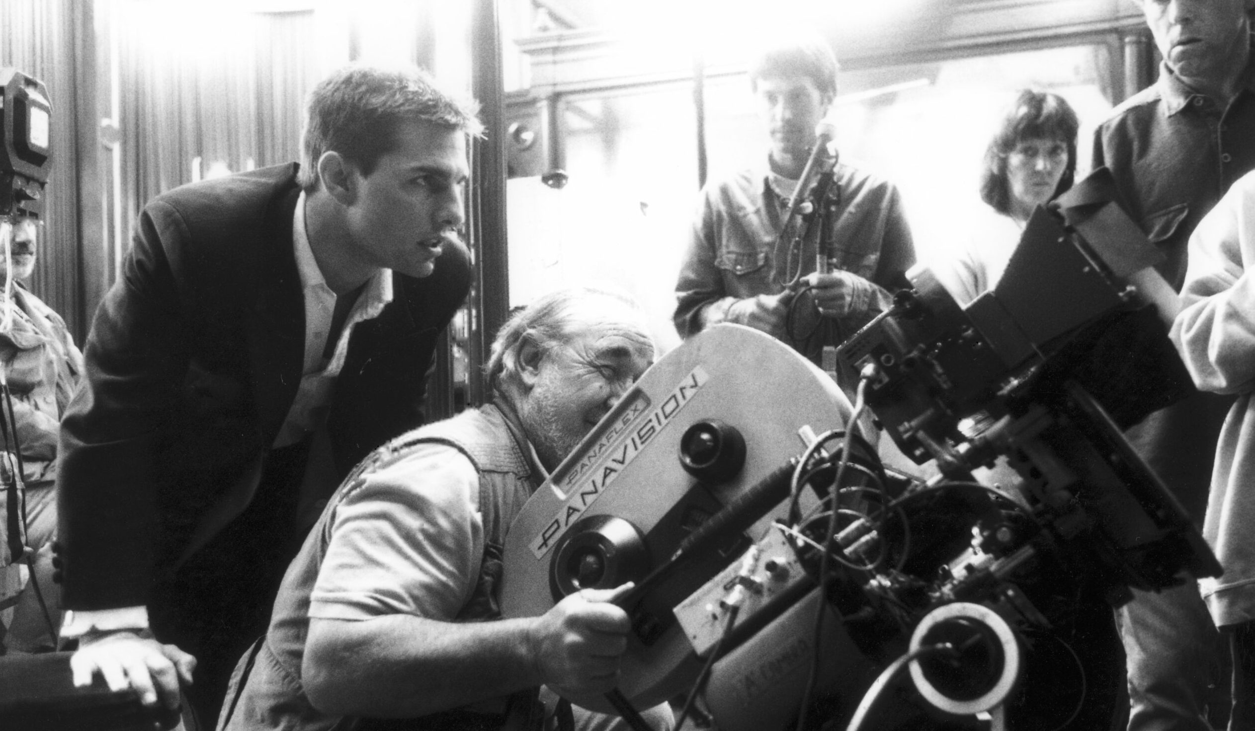 American actor Tom Cruise on set during the filming of the restaurant scene for the film 'Mission: Impossible', 1996.  (Ph...