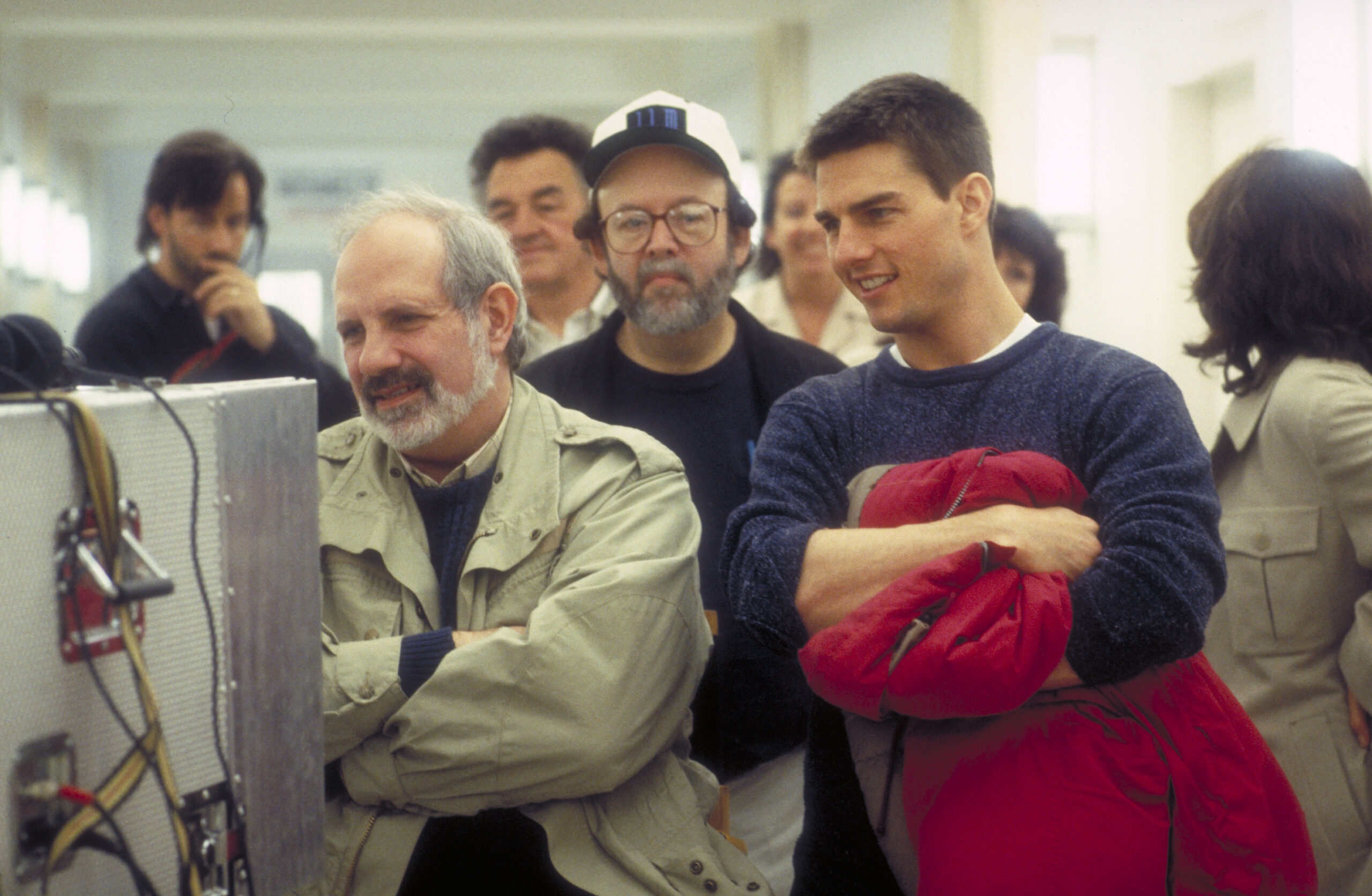 Director Brian De Palma and actor Tom Cruise watching the rushes on the set of the film 'Mission: Impossible', 1996. (Phot...