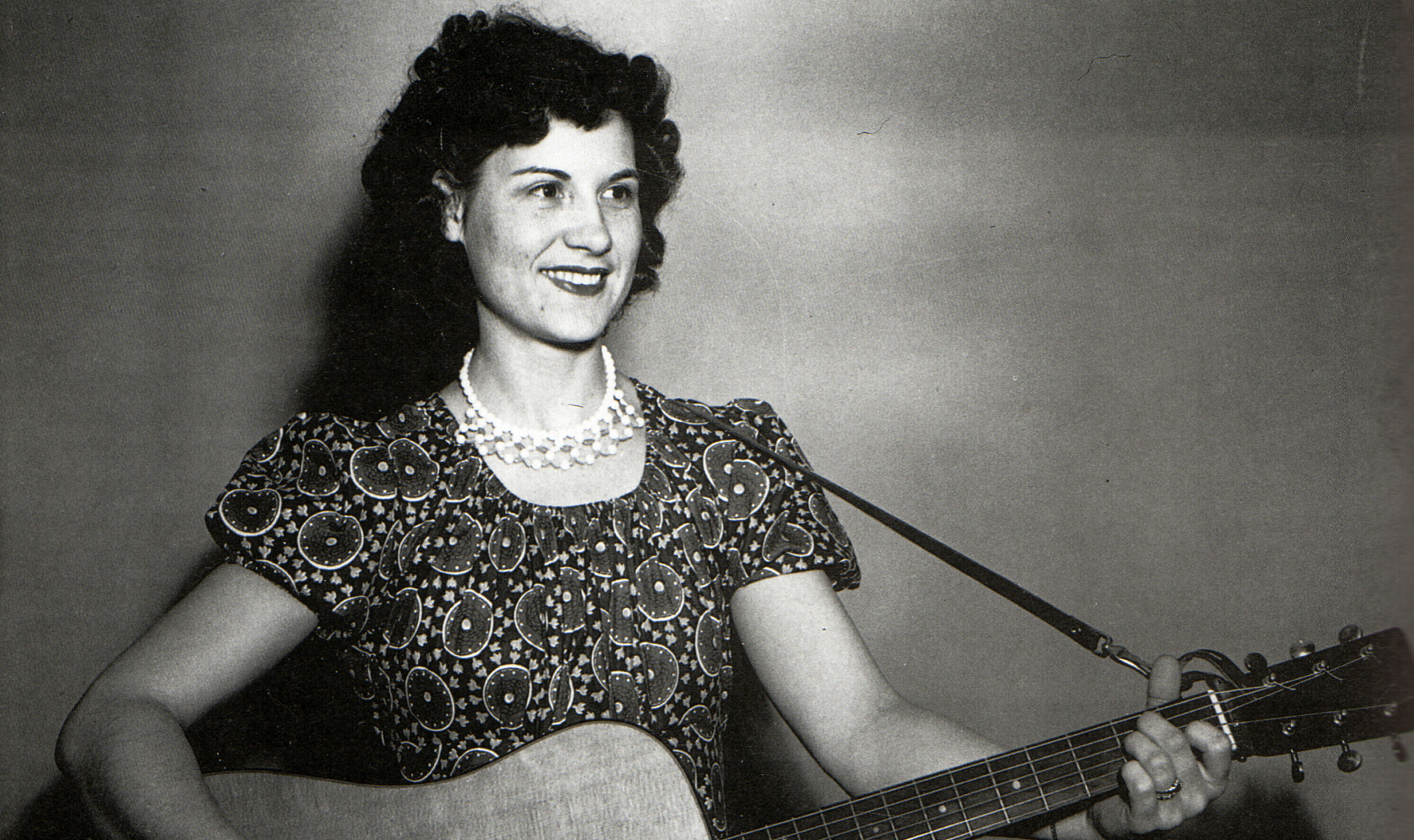 UNSPECIFIED - circa 1950: (AUSTRALIA OUT) Photo of American country singer and guitarist Kitty Wells (1919-2012) posed wit...