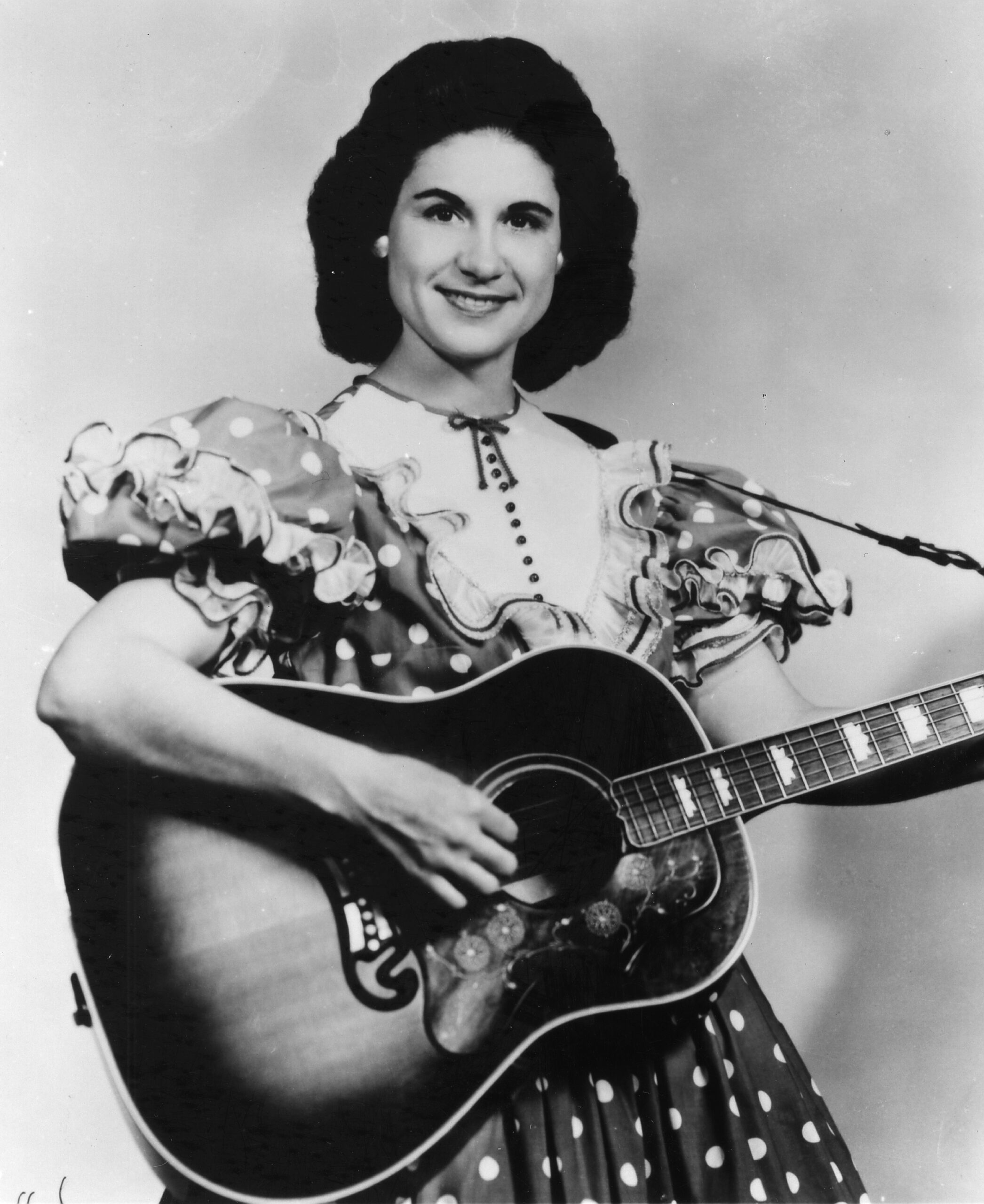 CIRCA 1959: Country singer Kitty Wells poses for a portrait holding an acoustic guitar in circa 1959. (Photo by Michael Oc...