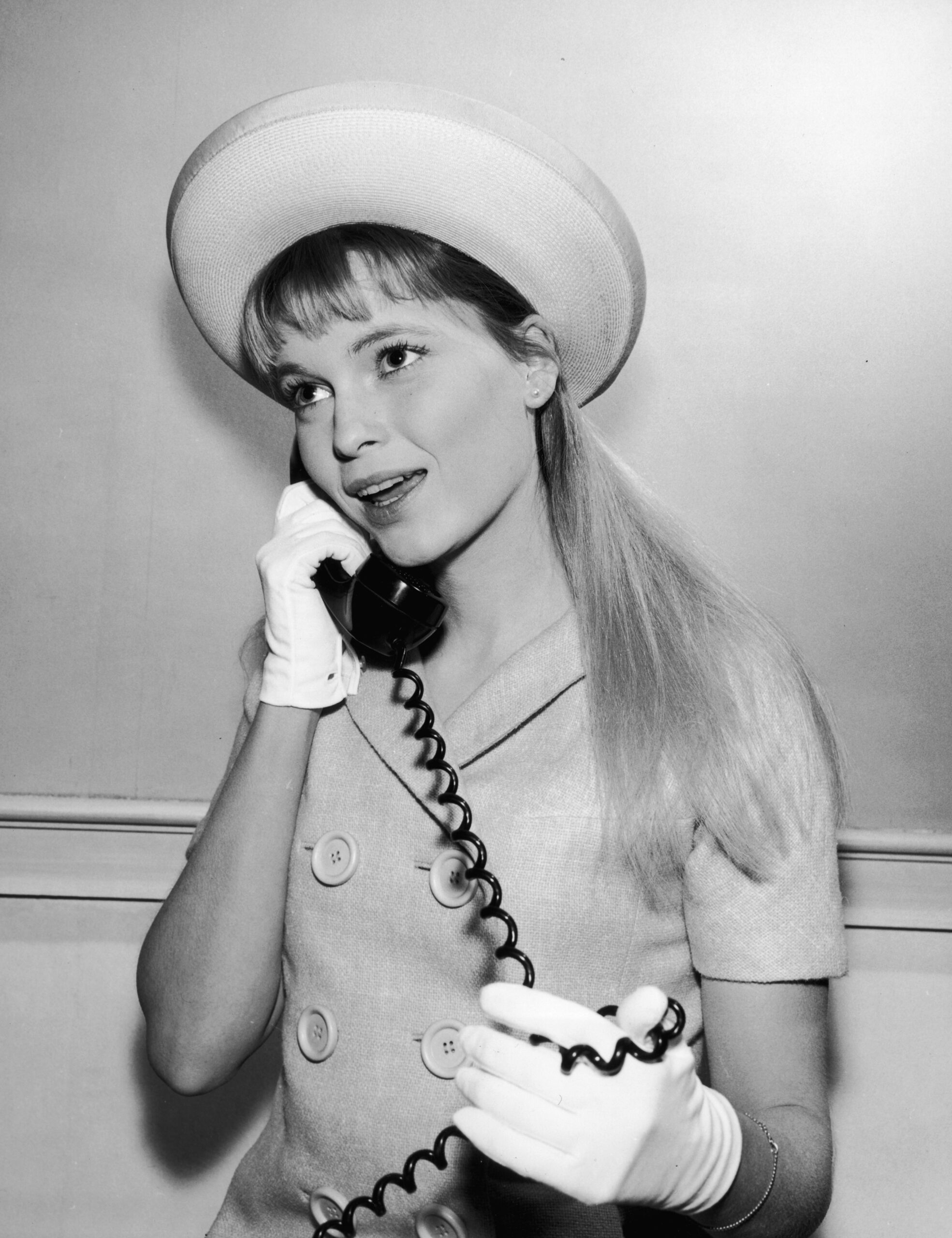American actor Mia Farrow on the phone in television's first serial drama, 'Peyton Place,' (1964-1969.)  The show was base...