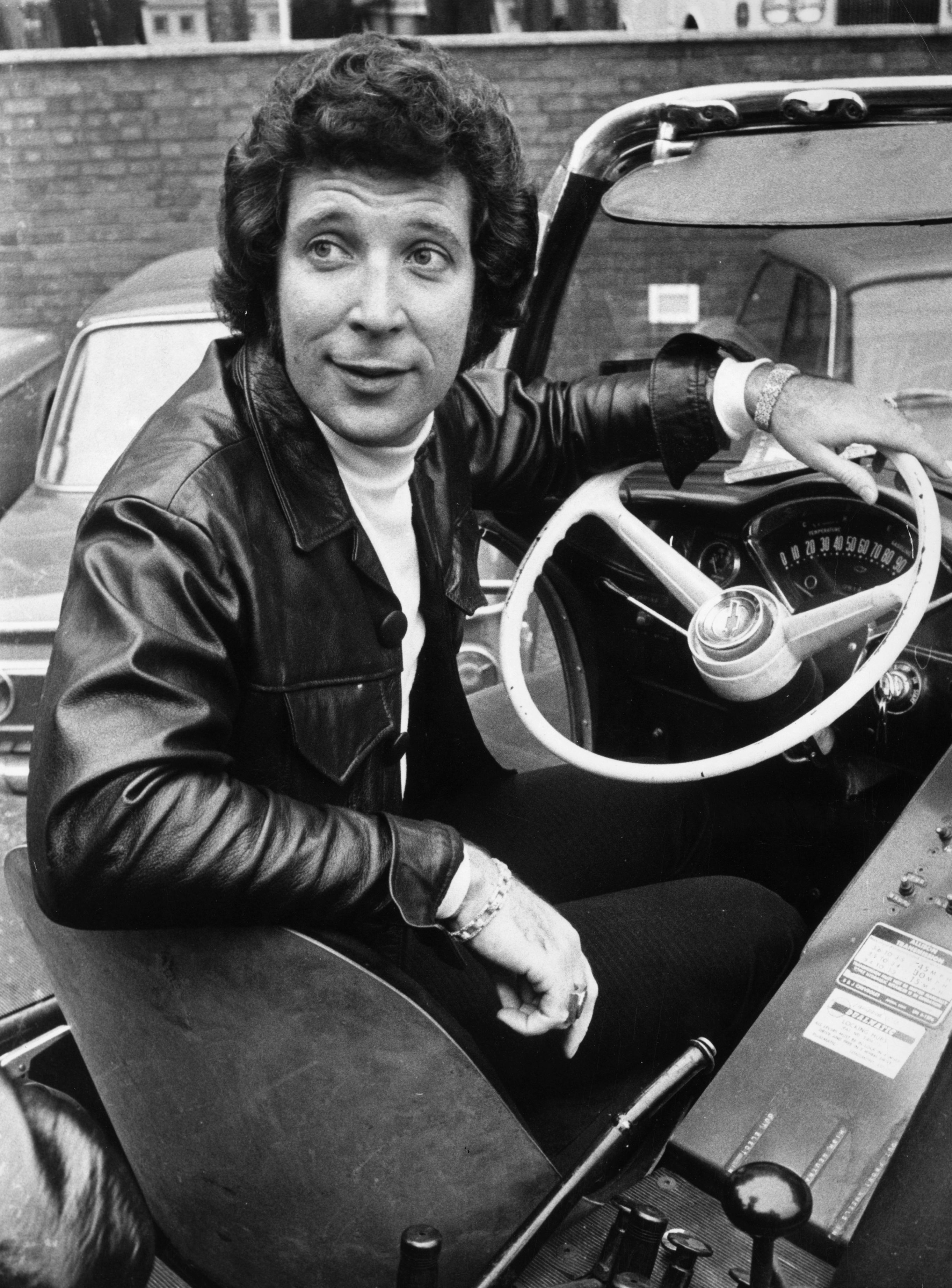 13th November 1971:  Tom Jones at the wheel of his car on a visit to the BBC TV centre, London.  (Photo by Steve Wood/Even...
