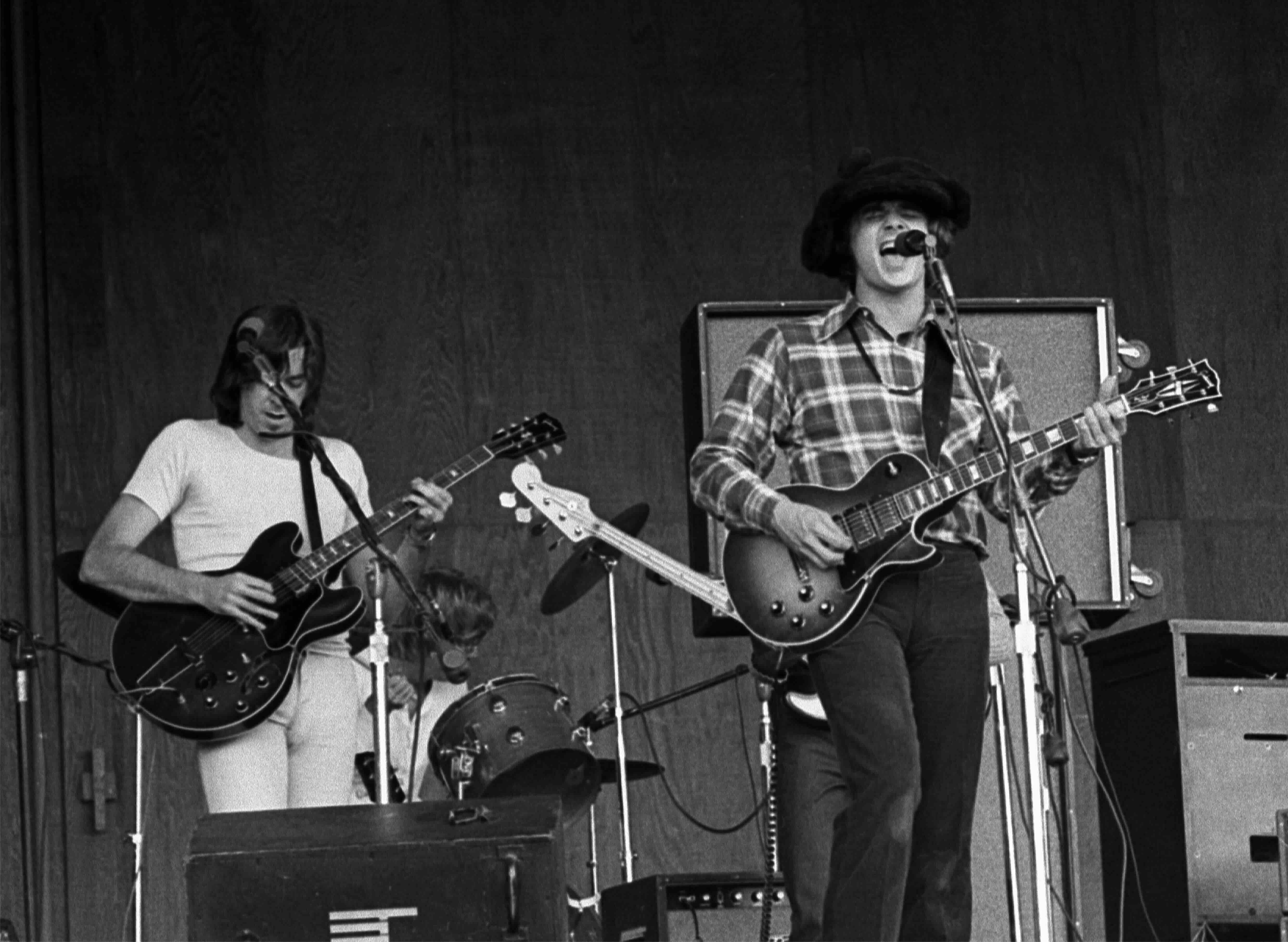 American Rock musician Steve Miller (right), on guitar, leads his band during a performance, Monterey, California, late 19...