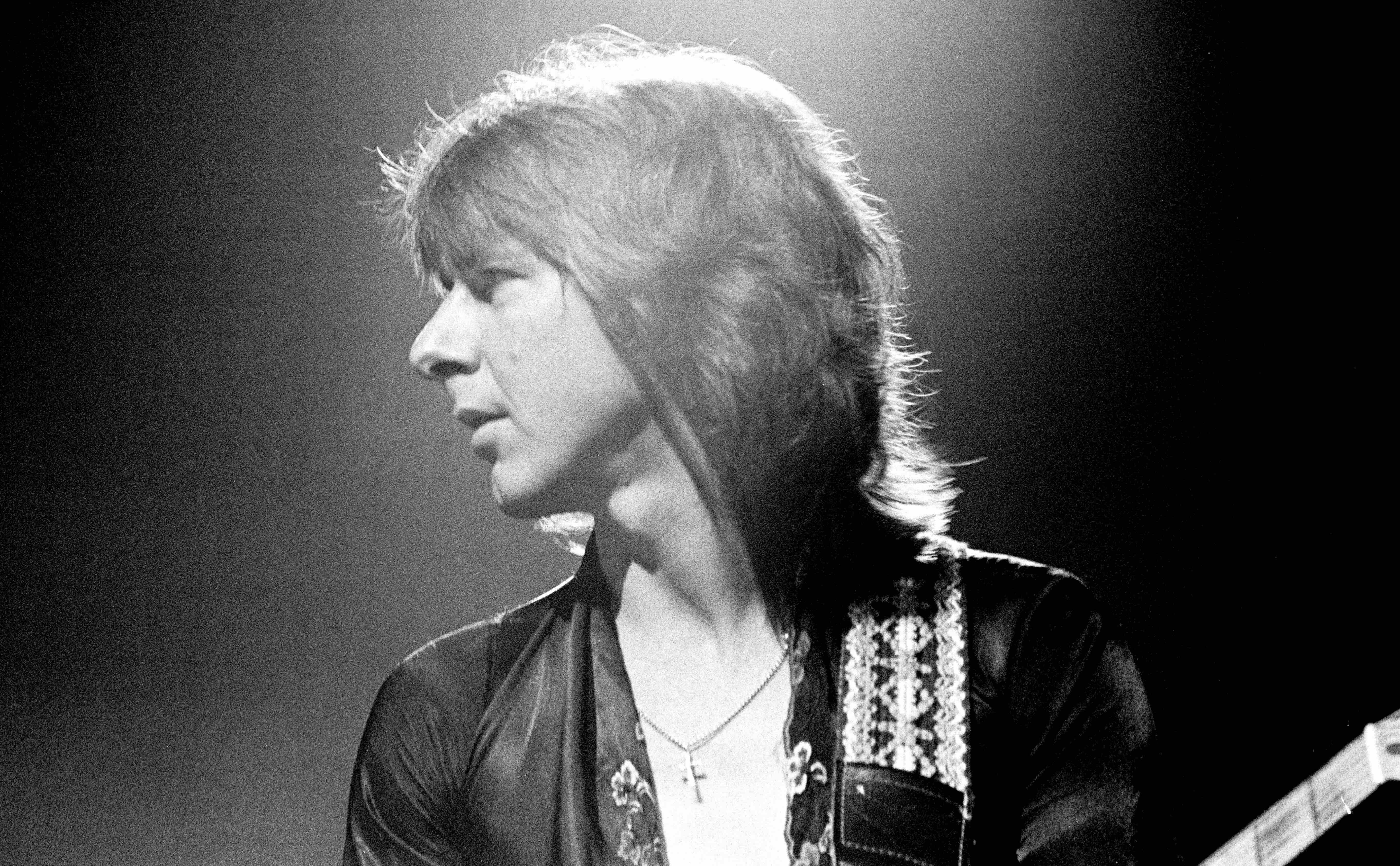 View of English Rock & Blues musician Mick Ralphs, of the band Bad Company, plays guitar as he performs, during the 'Desol...