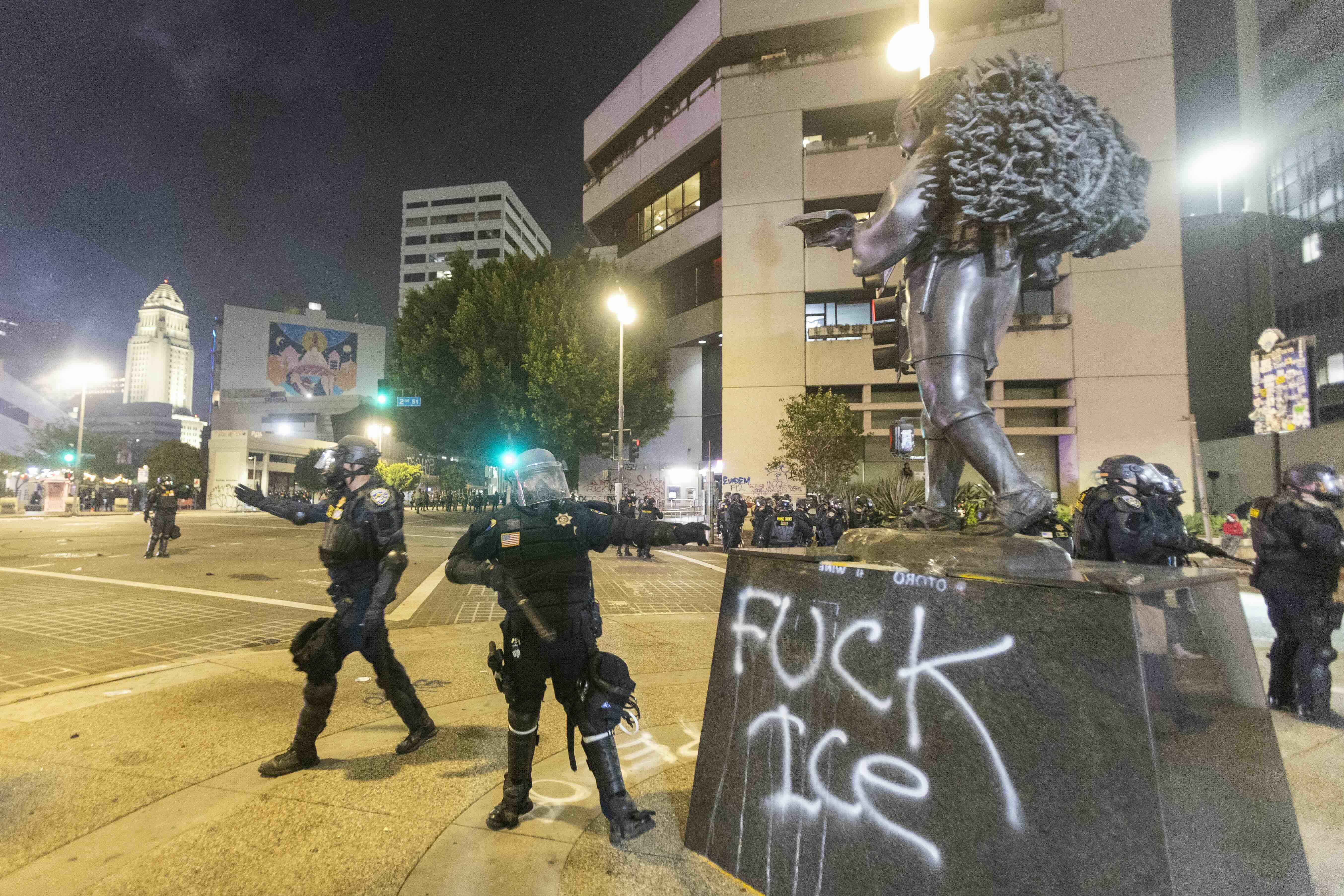 Police in riot gear clear the streets during a protest following federal immigration operations in Los Angeles on June 9, ...