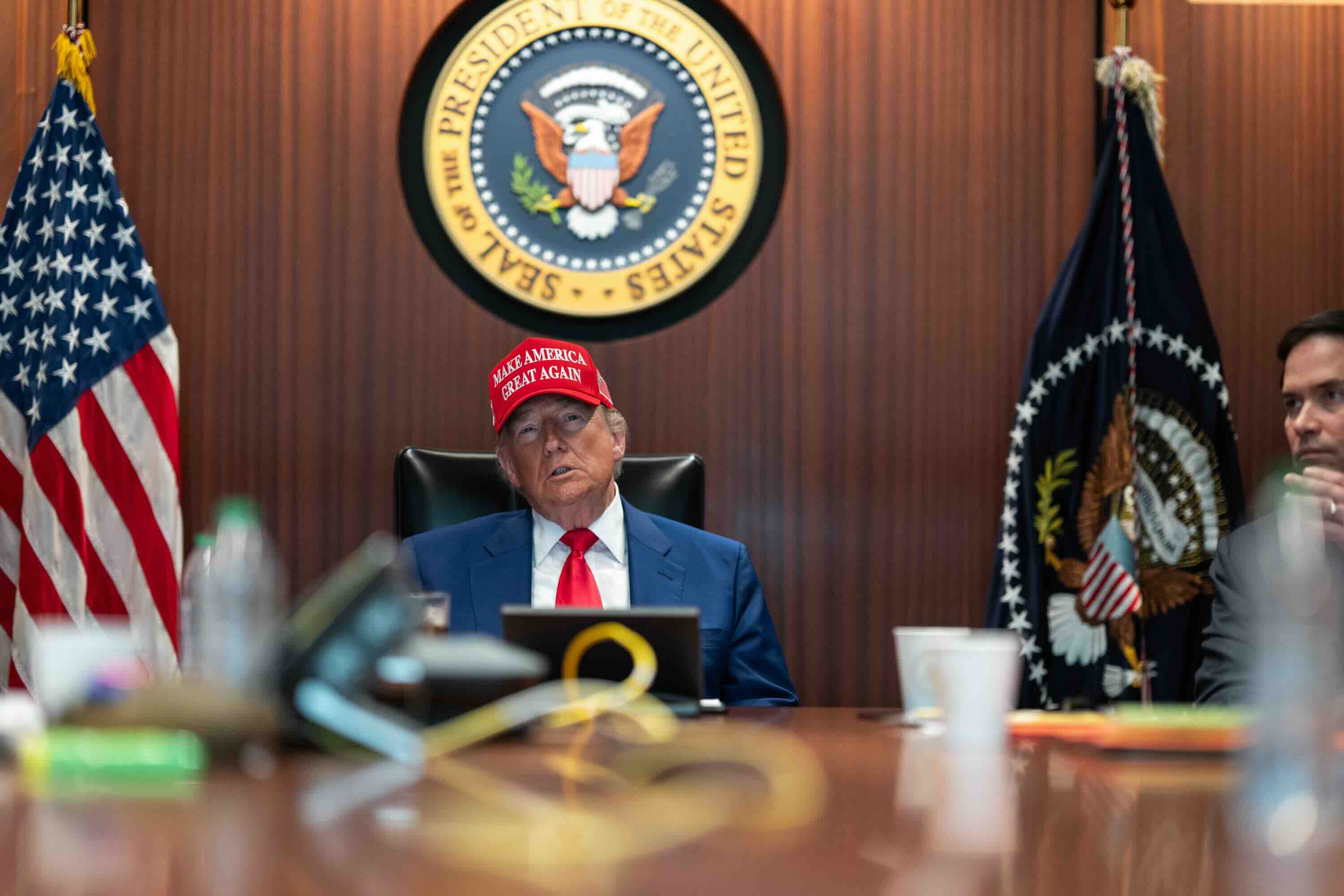 President Donald Trump and his national security team meet in the Situation Room of the White House, Saturday, June 21, 20...