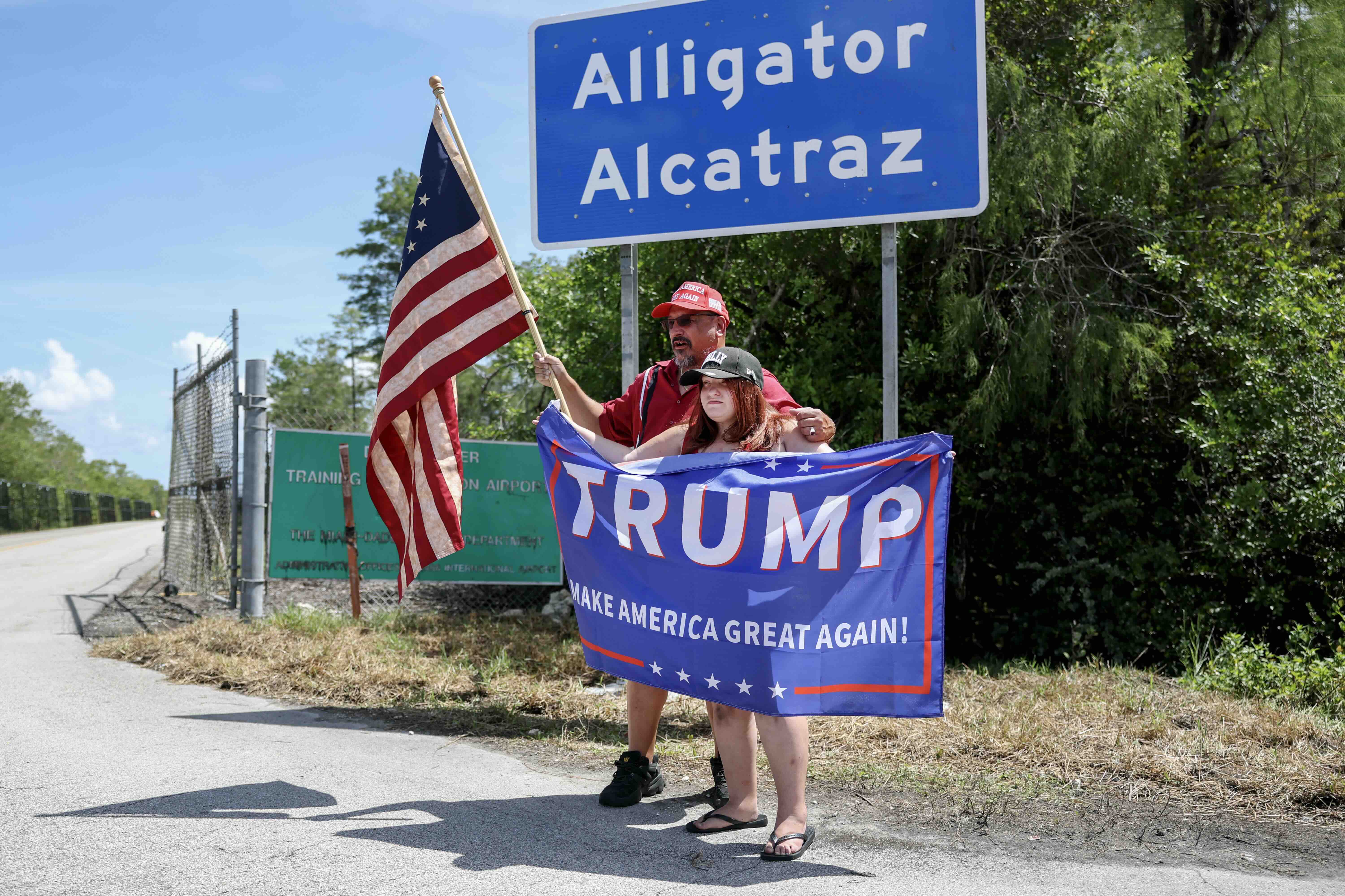 OCHOPEE, FLORIDA - JULY 12: David Mourer and his niece Rena Mourer visit the entrance to "Alligator Alcatraz" at the Dade-...