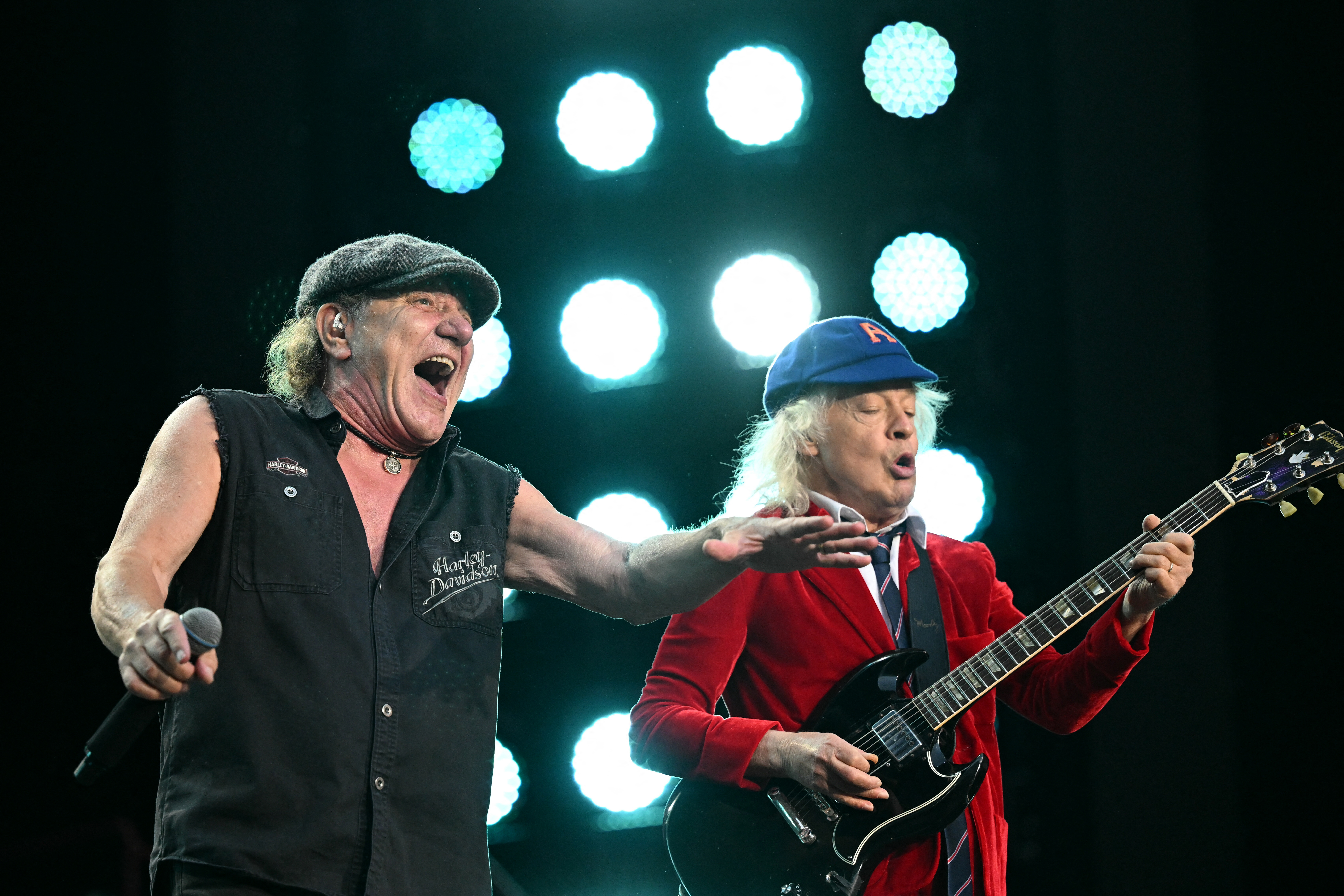 TOPSHOT - AC/DC's Brian Johnson (L) and Angus Young (R) perform on stage during the Australian rock bands "Power Up Tour" ...