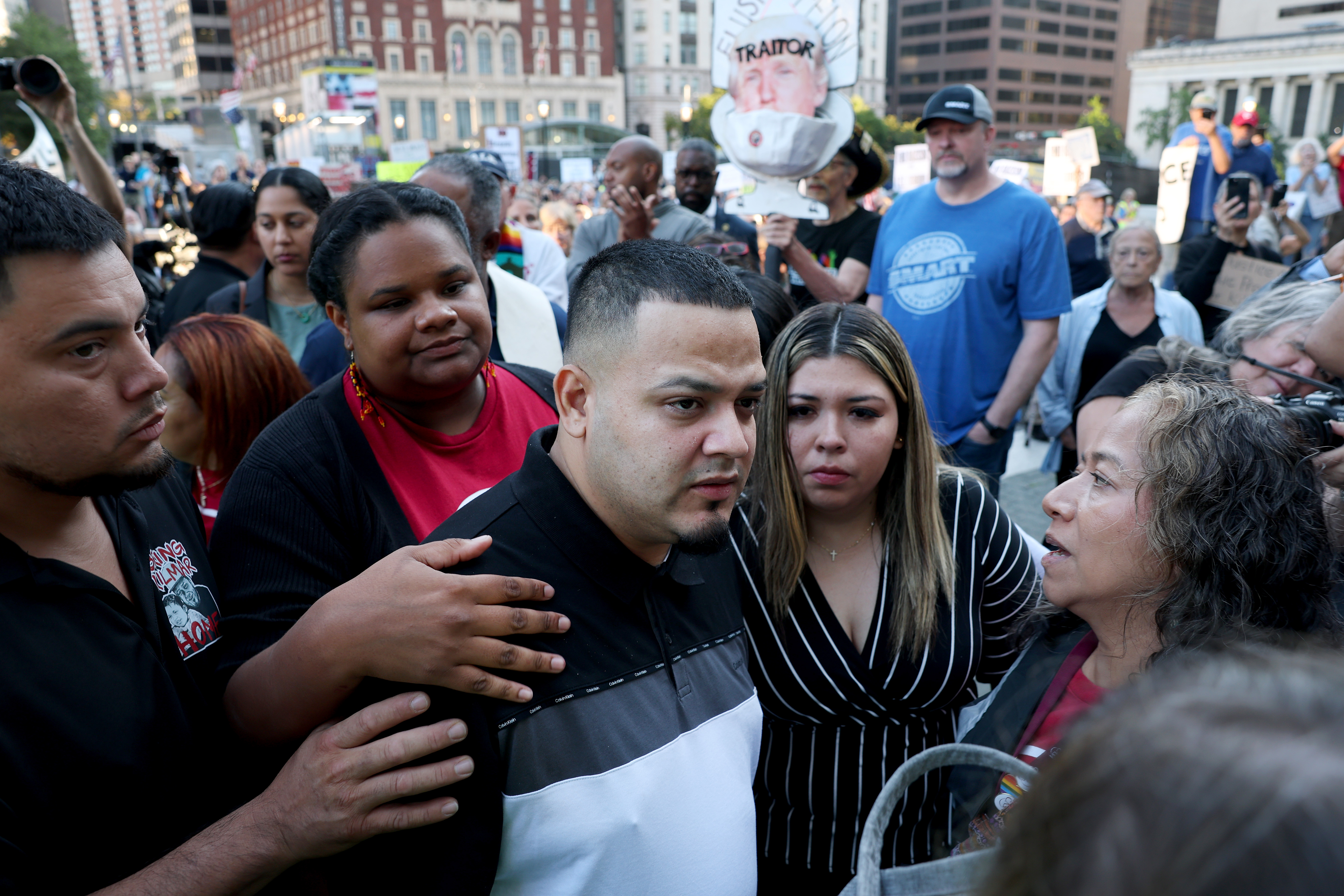 BALTIMORE, MARYLAND - AUGUST 25: Surrounded by reporters, Kilmar Abrego Garcia and his wife Jennifer Vasquez Sura enter a ...
