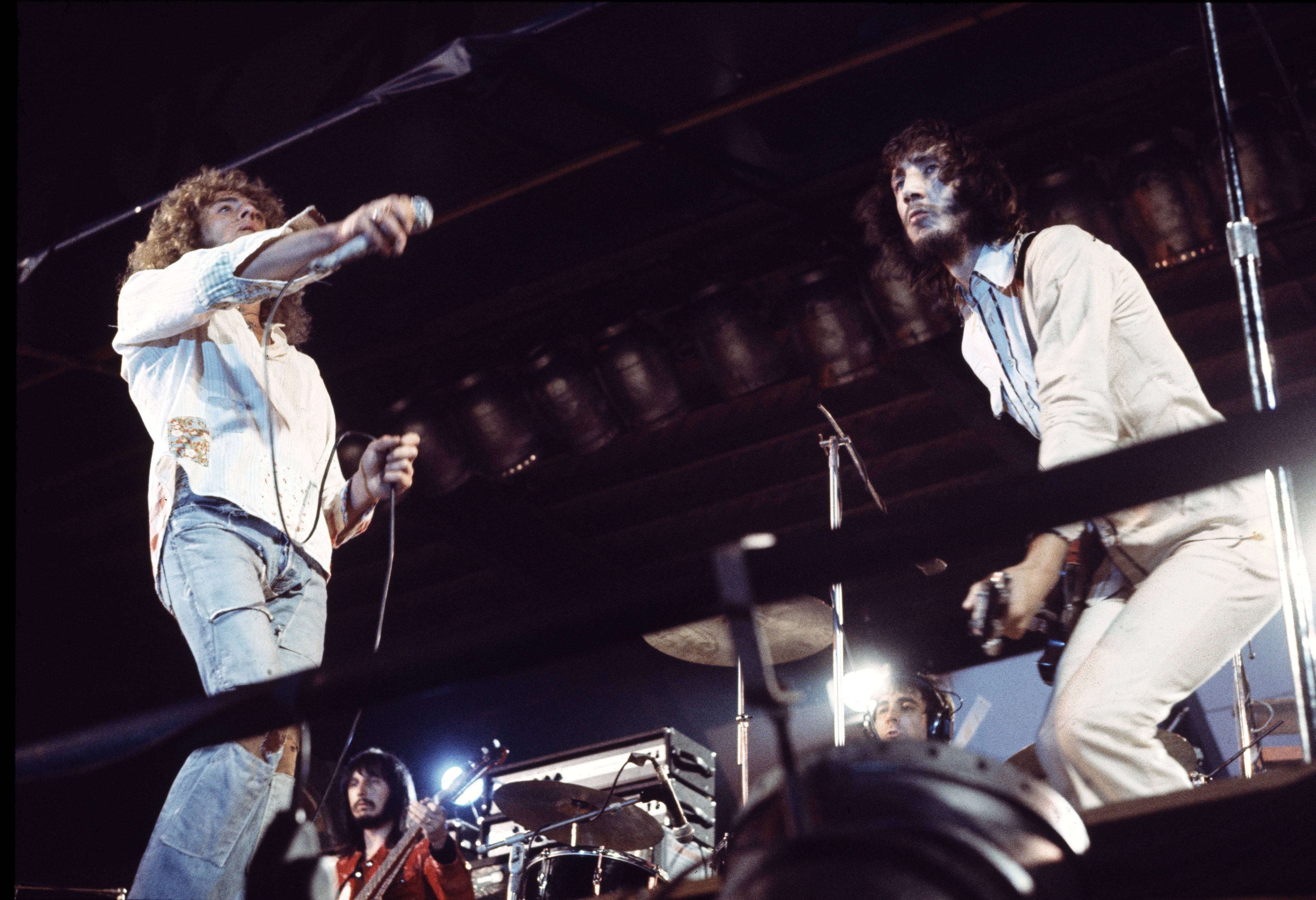 Rock band The Who perform on stage at The Oval cricket ground, London, 18th September 1971. L-R Roger Daltrey, John Entwis...