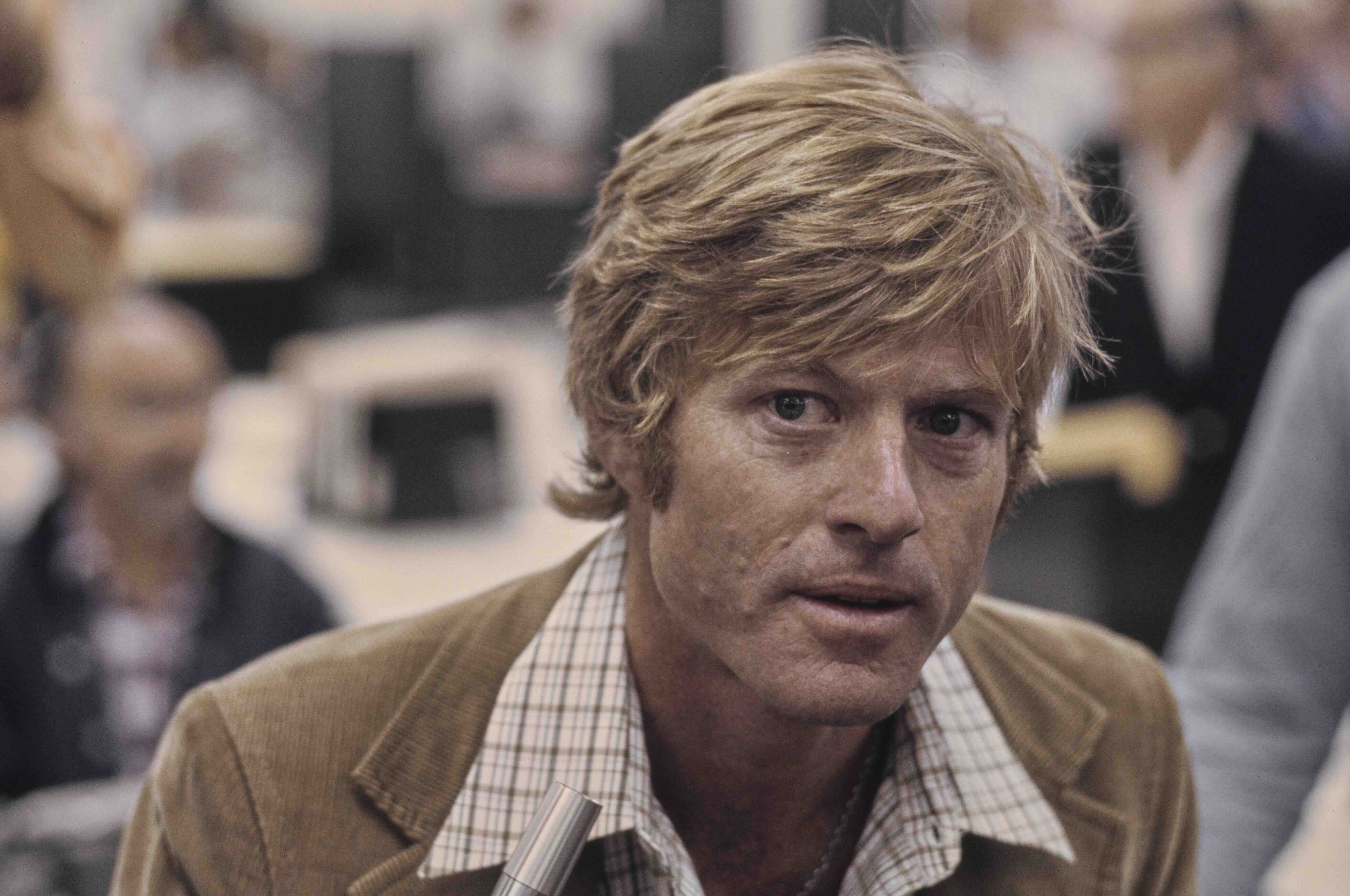 American actor Robert Redford, wearing a brown corduroy blazer over a checked shirt, in a recreation of The Washington Pos...