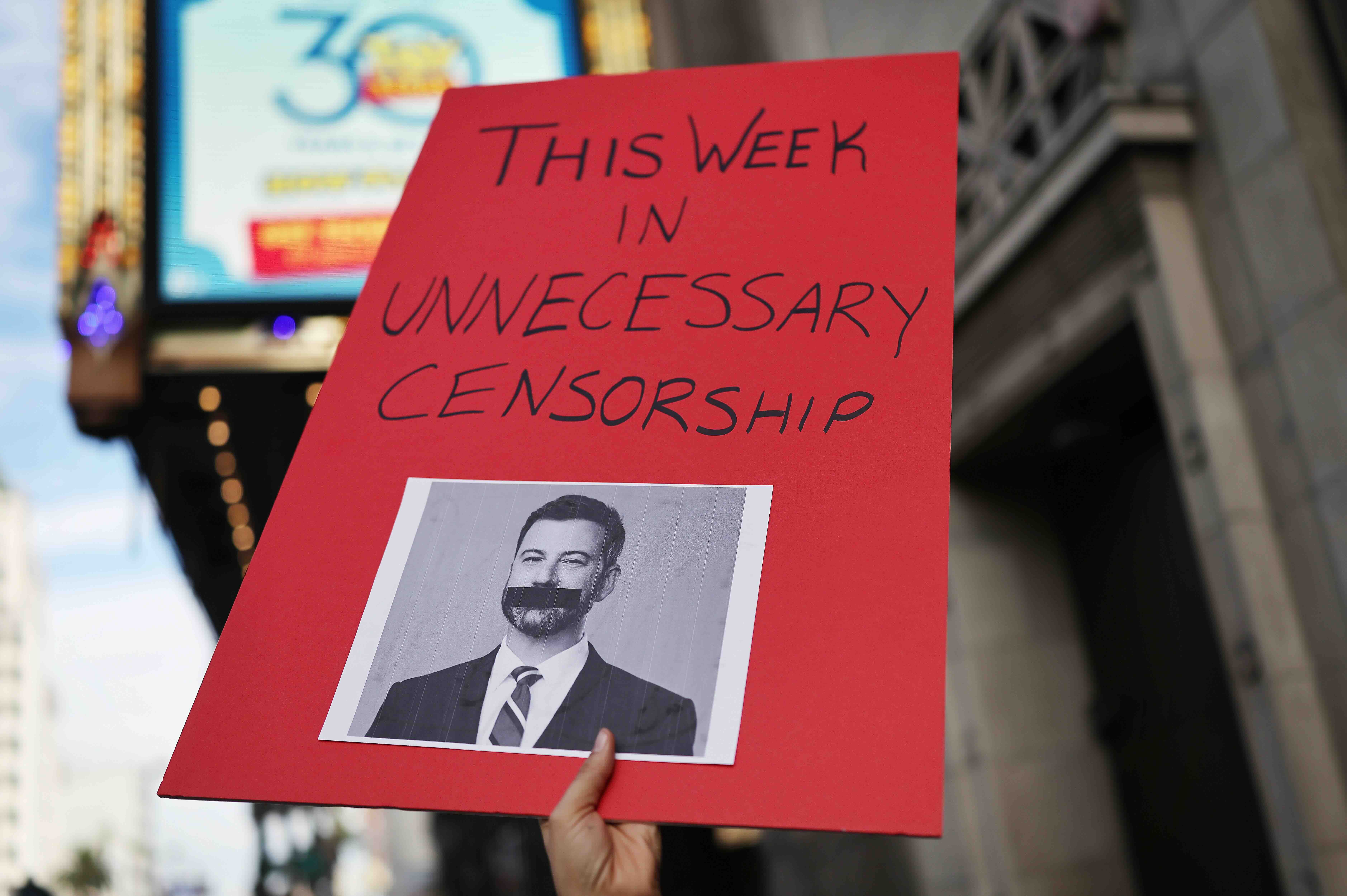 LOS ANGELES, CALIFORNIA - SEPTEMBER 18: A person holds a sign reading "This Week In Unnecessary Censorship" as demonstrato...