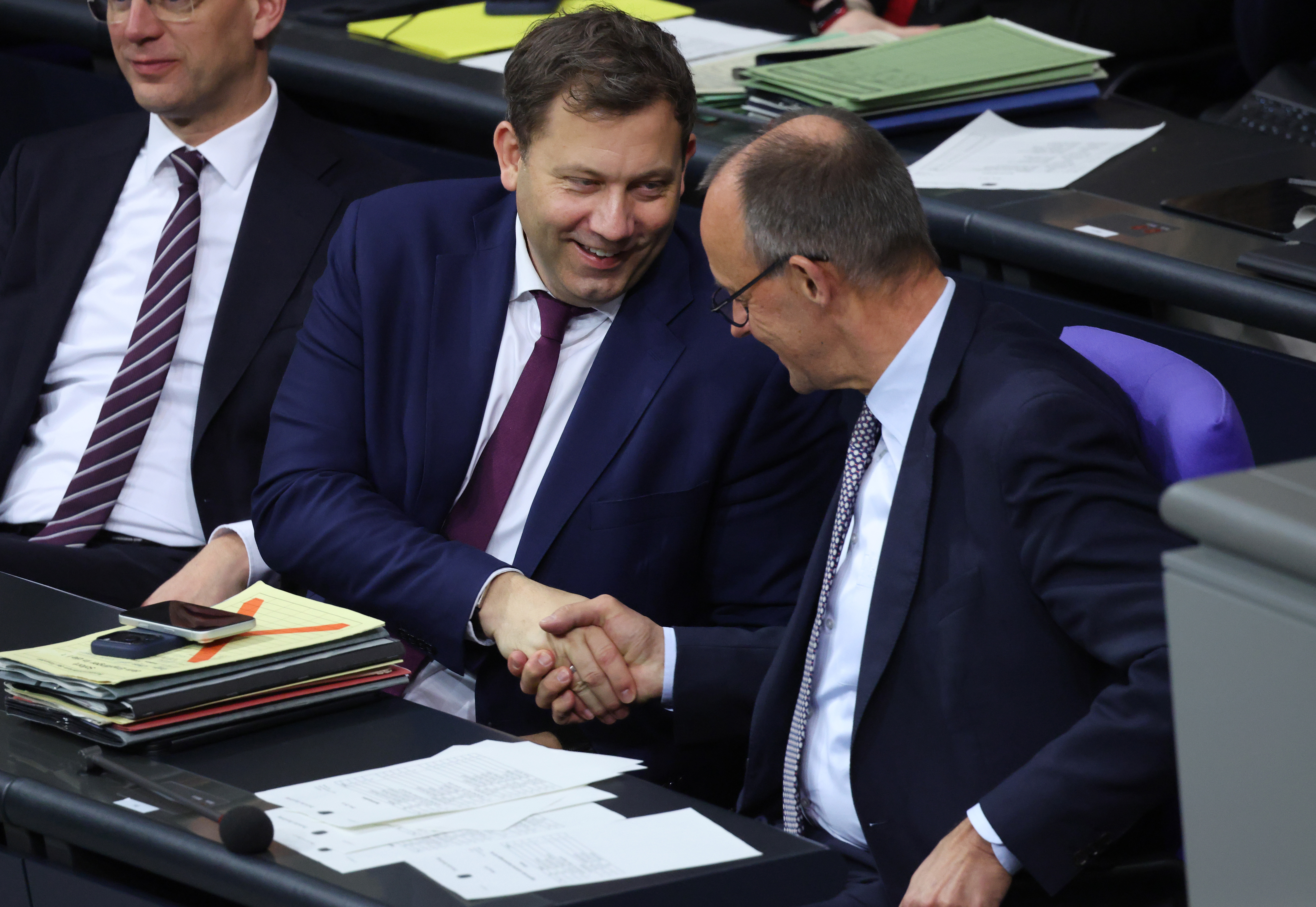 BERLIN, GERMANY - DECEMBER 05: German Chancellor Friedrich Merz (R) and Finance Minister Lars Klingbeil attend debates ove...