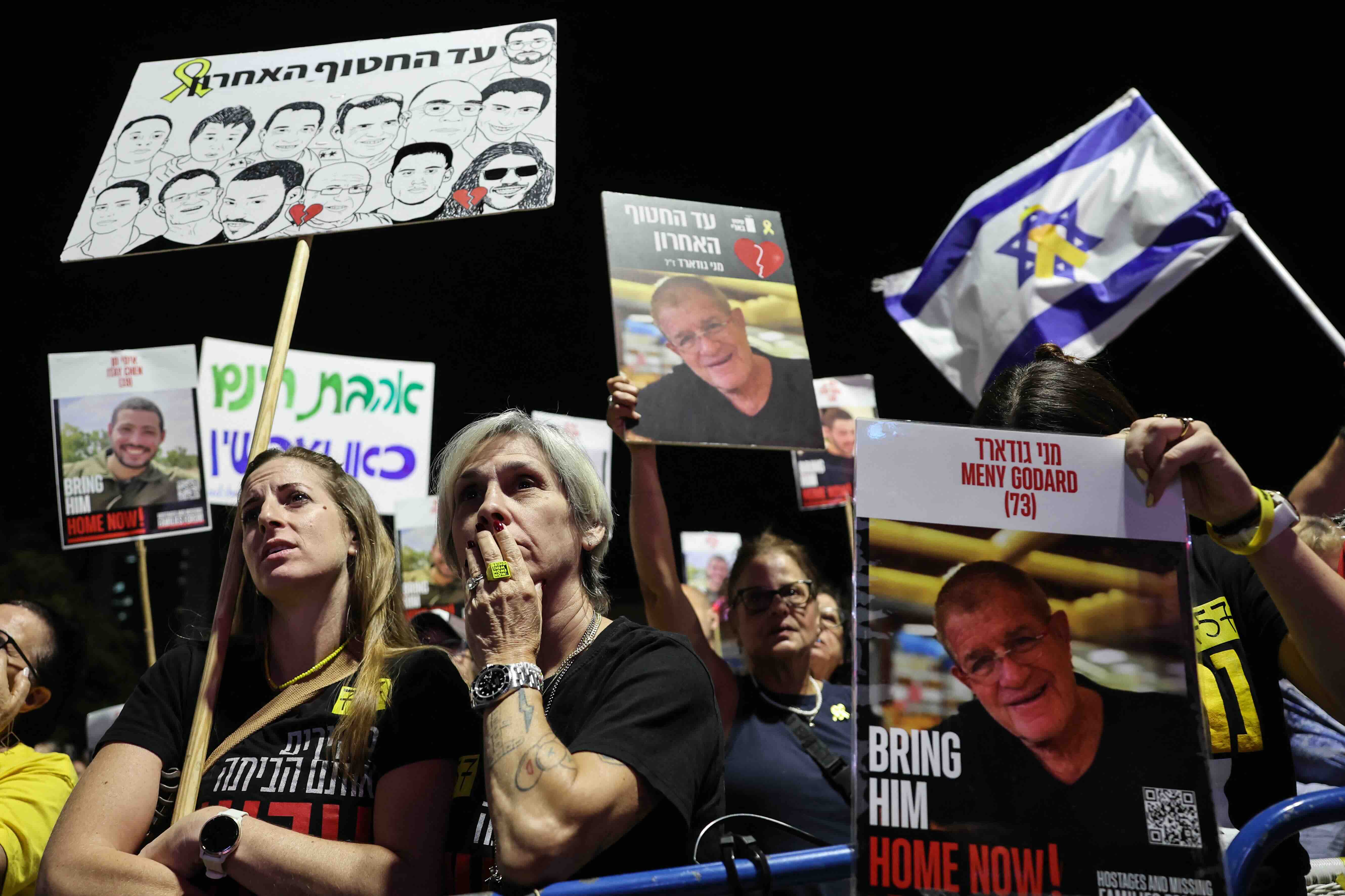 Women react during a rally organised by hostage families and calling for the return of the bodies of the remaining hostage...