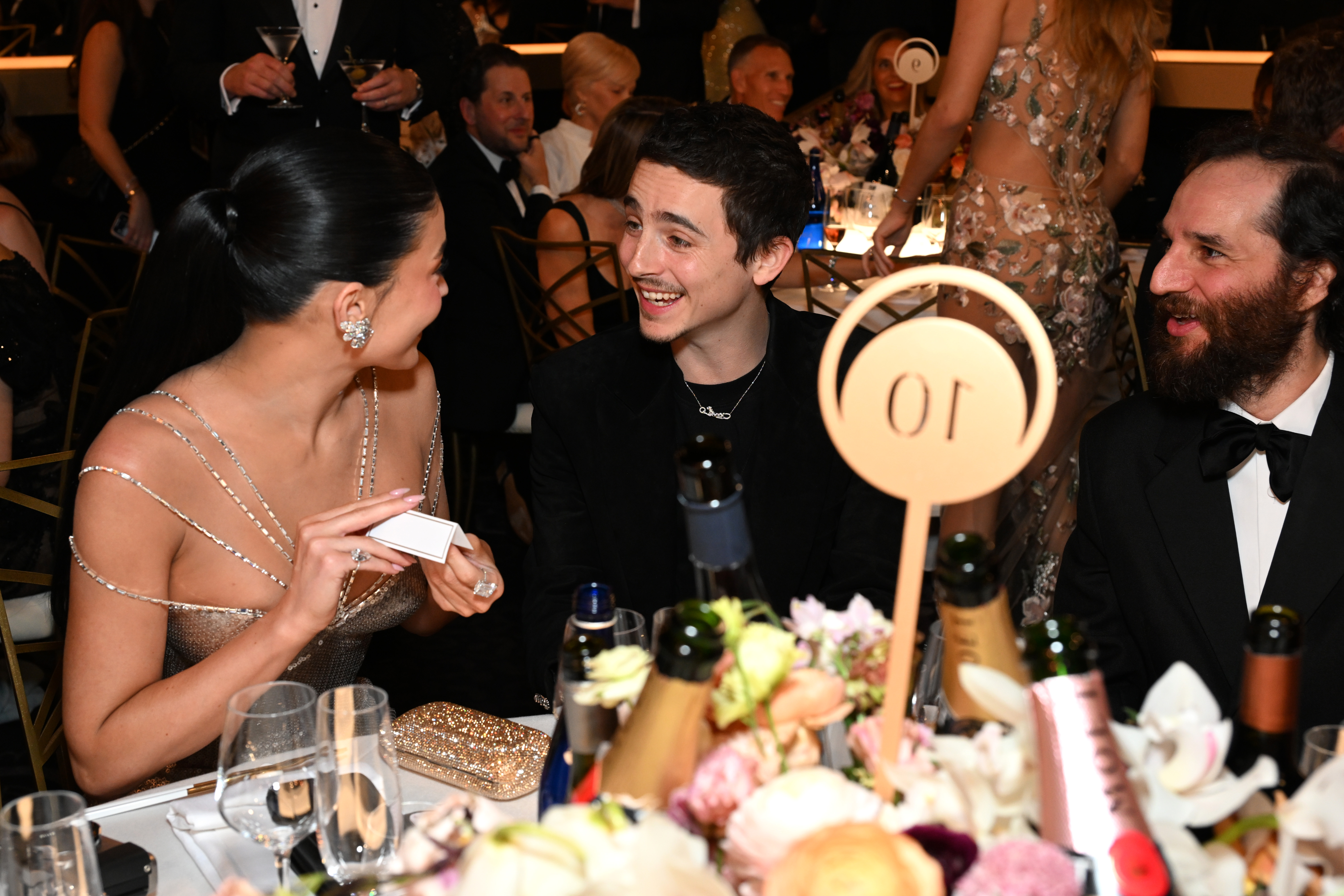 LOS ANGELES, CALIFORNIA - JANUARY 11: (L-R) Kylie Jenner, Timothée Chalamet and Josh Safdie attend Moët & Chandon At The...