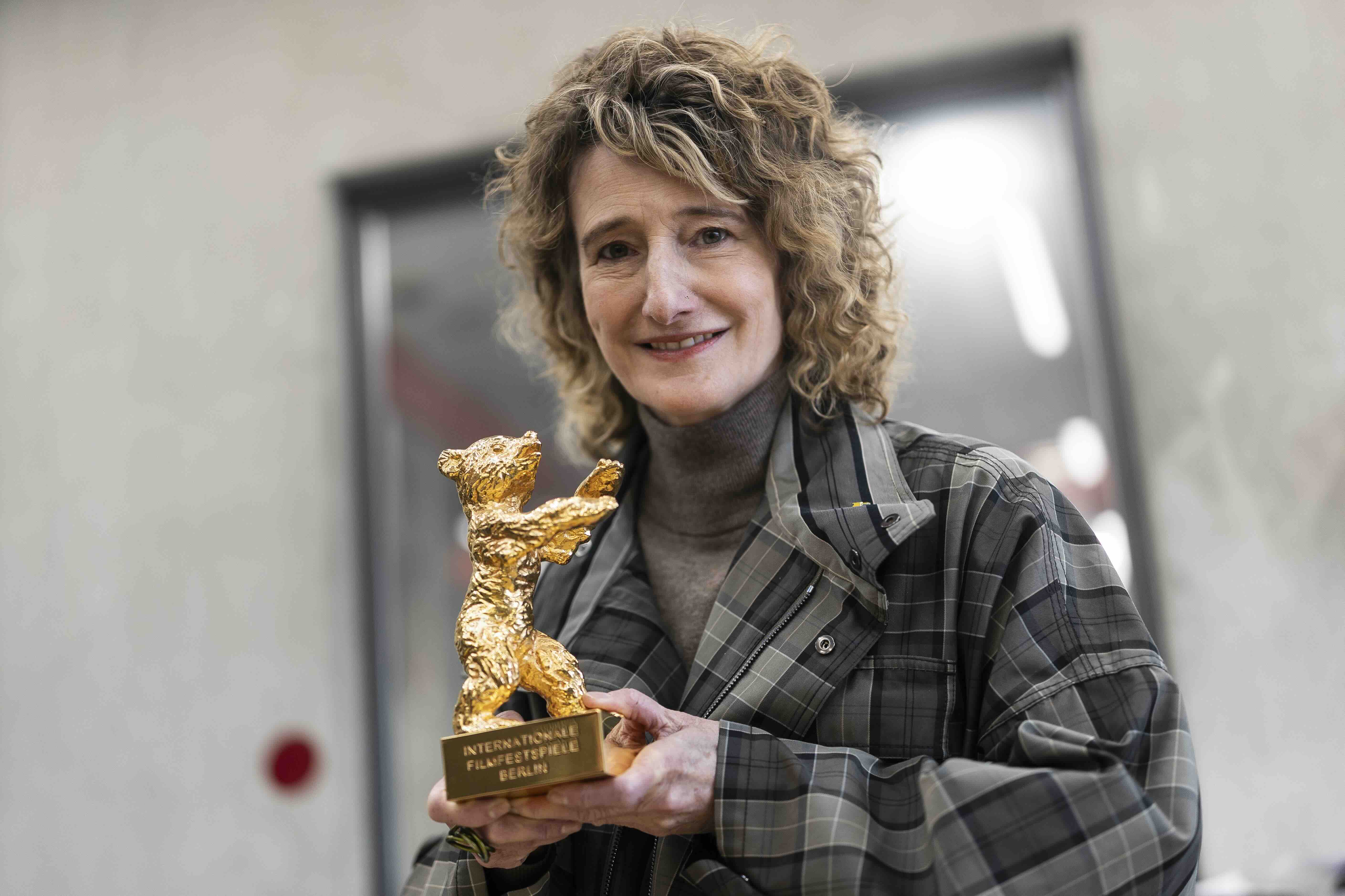 BERLIN, GERMANY - JANUARY 15: Berlinale director Tricia Tuttle holds a Berlinale Bear Trophy during a visit to the Hermann...
