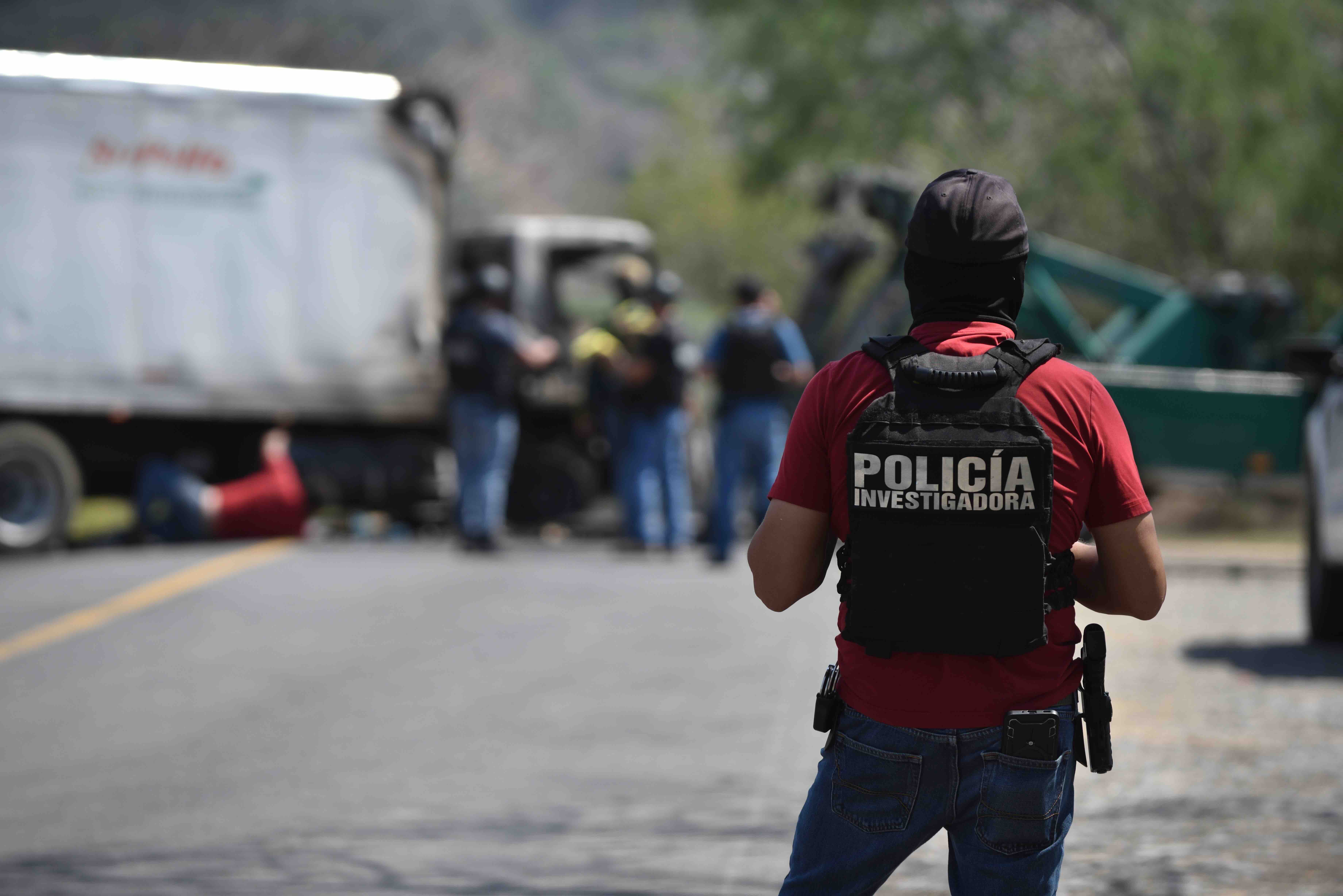 COLIMA, MEXICO - FEBRUARY 22: A Police officer stands guard at Colima on February 22, 2026 in Colima, Mexico. Road blockad...