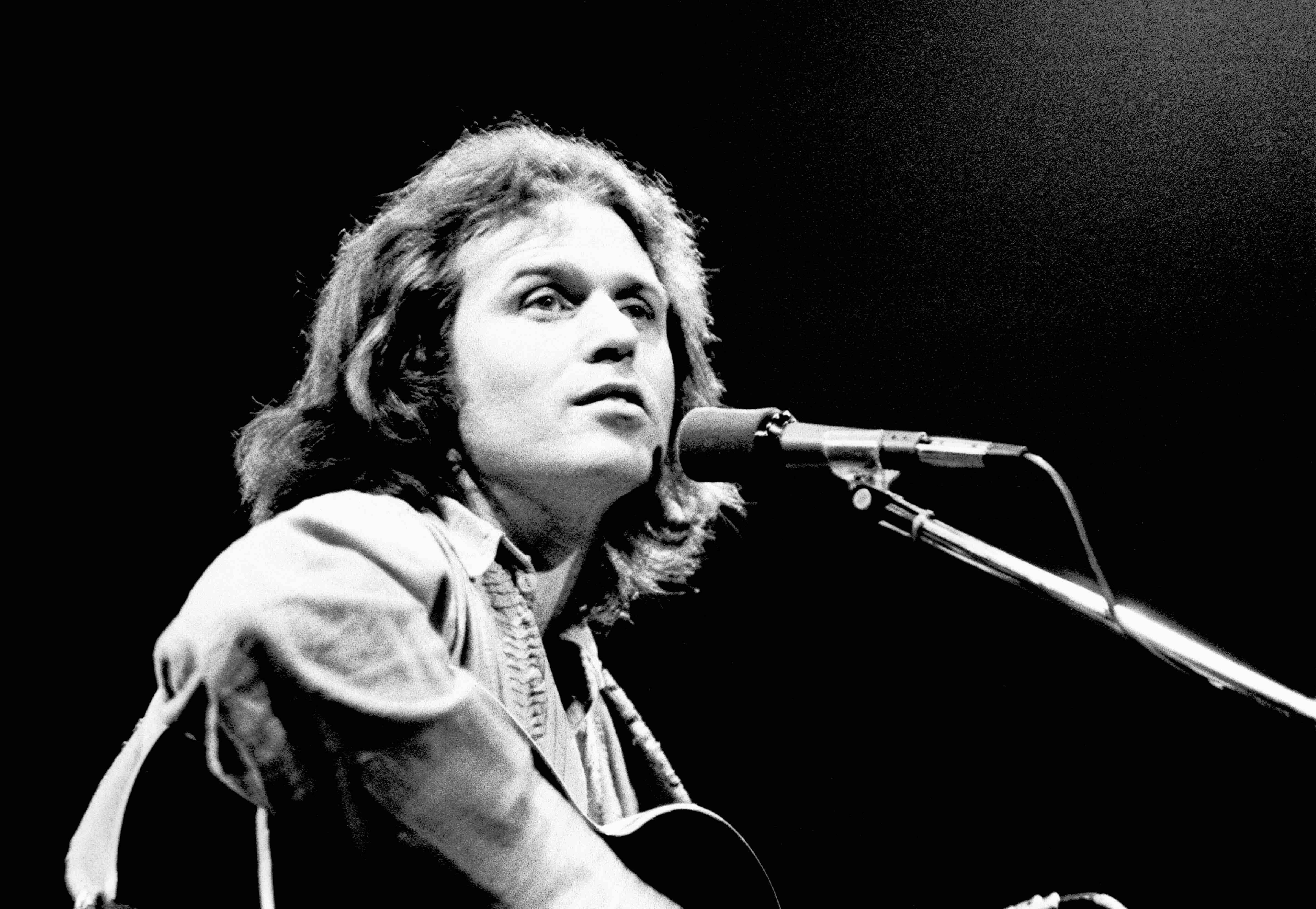 Country Joe McDonald performs by himself at the Roundhouse, London, England, on October 13th 1974. (Photo by Gus Stewart/R...