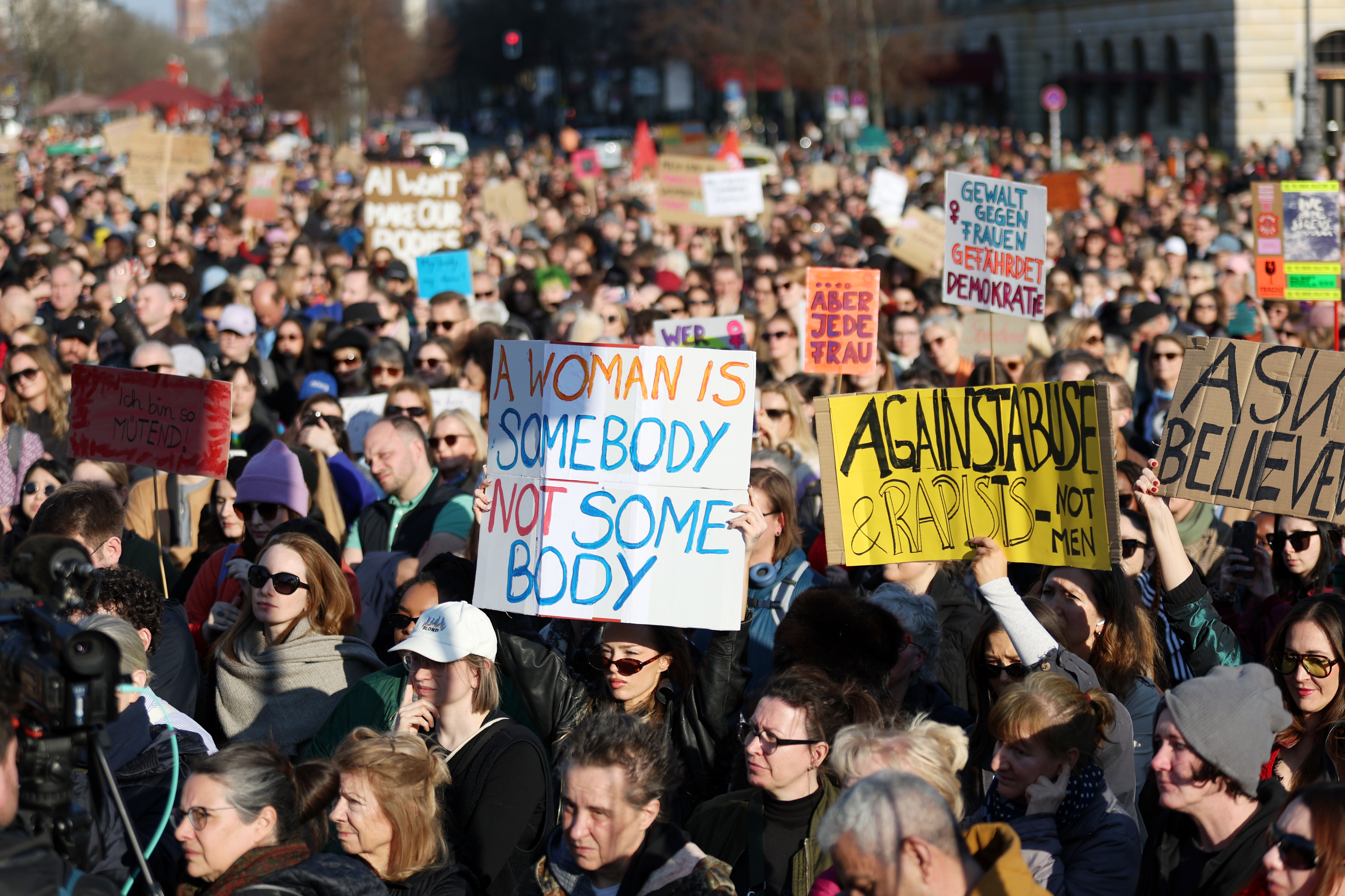 BERLIN, GERMANY - MARCH 22: Women hold up placards as they take part in a demonstration in support of Actress Collien Fern...