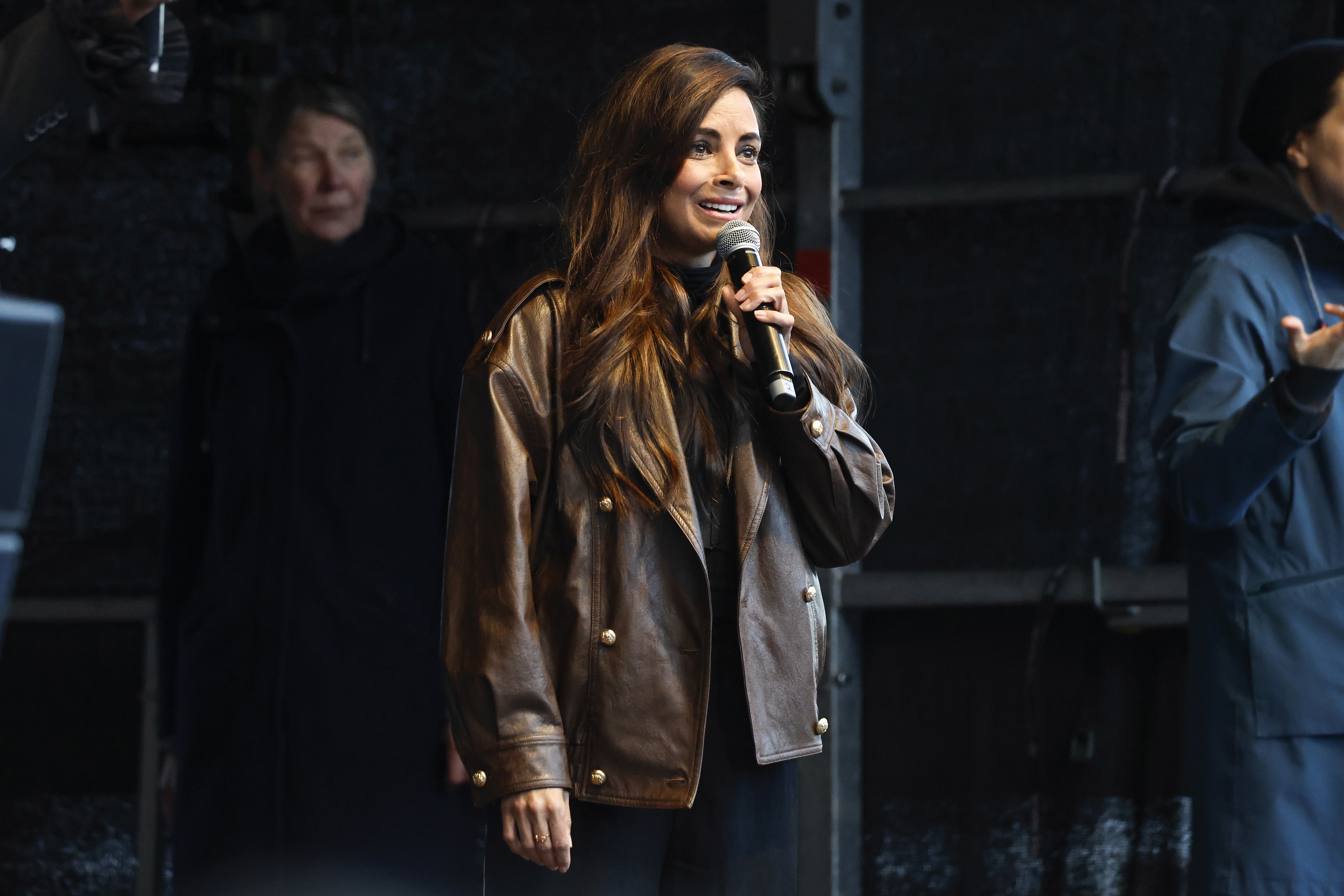 HAMBURG, GERMANY - MARCH 26: Actress and TV host Collien Fernandes speaks as people gather to protest against online aussa...