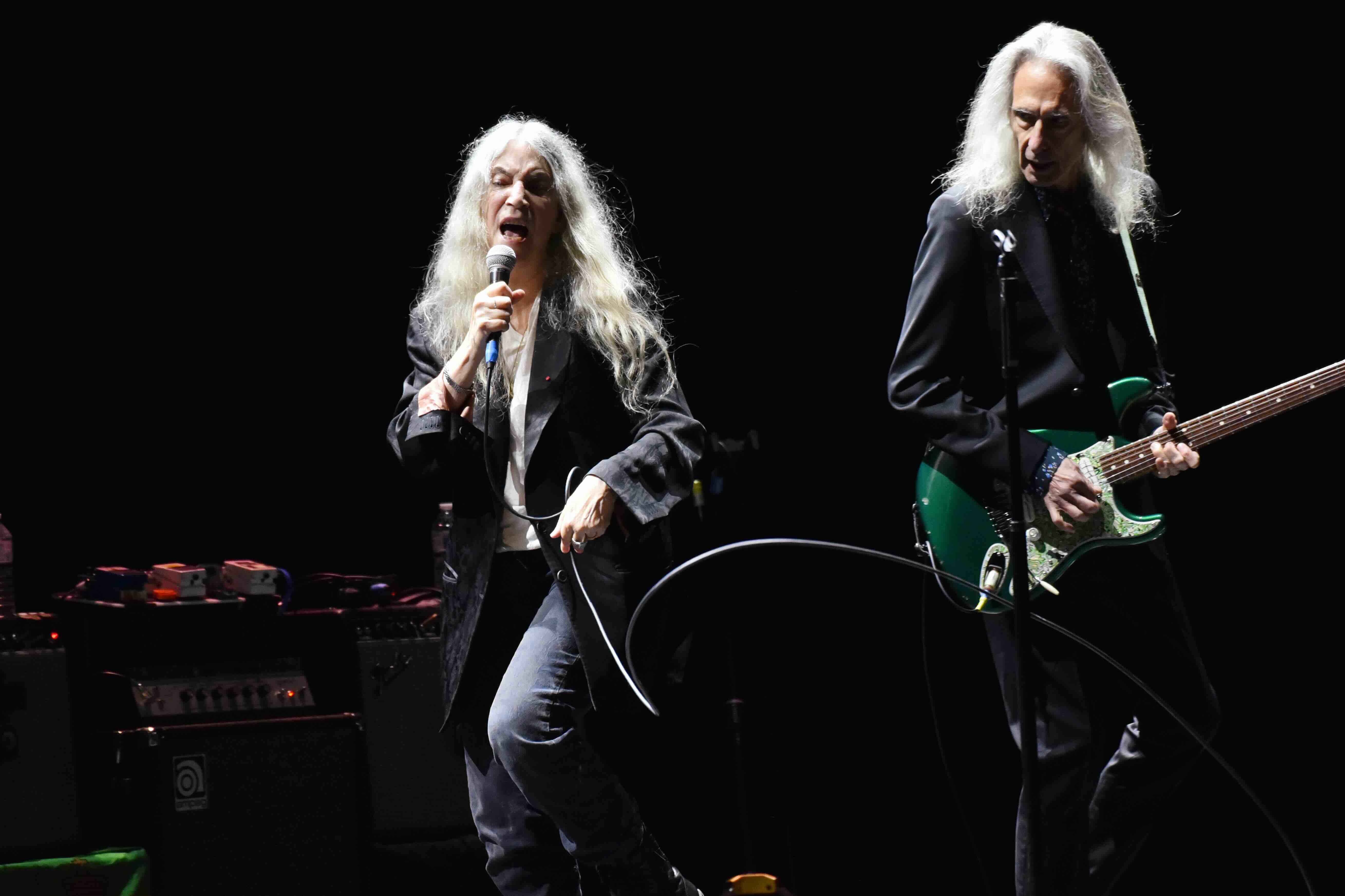 LONDON, ENGLAND - OCTOBER 12: Patti Smith and Lenny Kaye perform onstage at the London Palladium during the 'Horses - 50th...