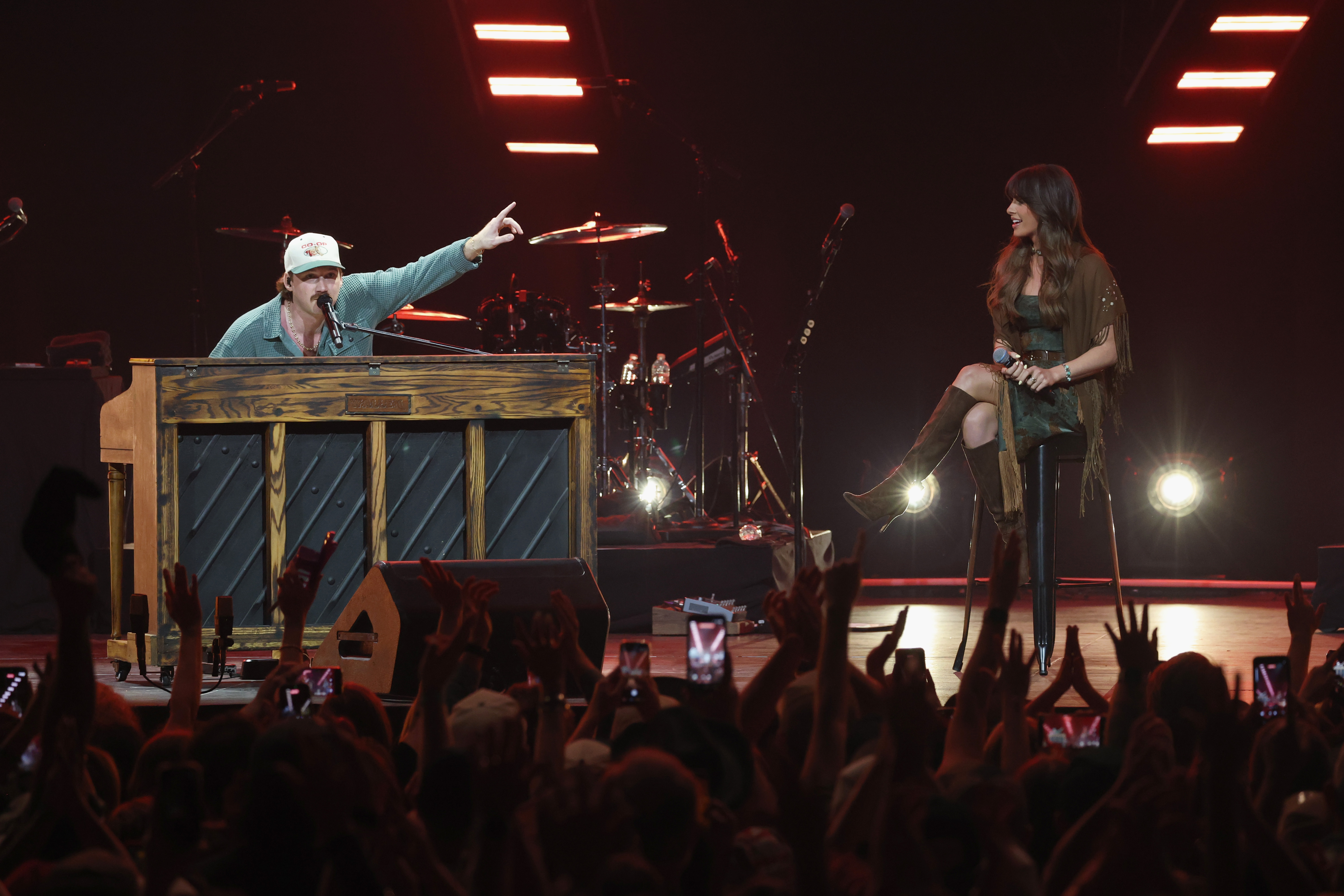 NASHVILLE, TENNESSEE - APRIL 02: (L-R) Morgan Wallen and Ella Langley perform onstage to celebrate the launch of new exclu...