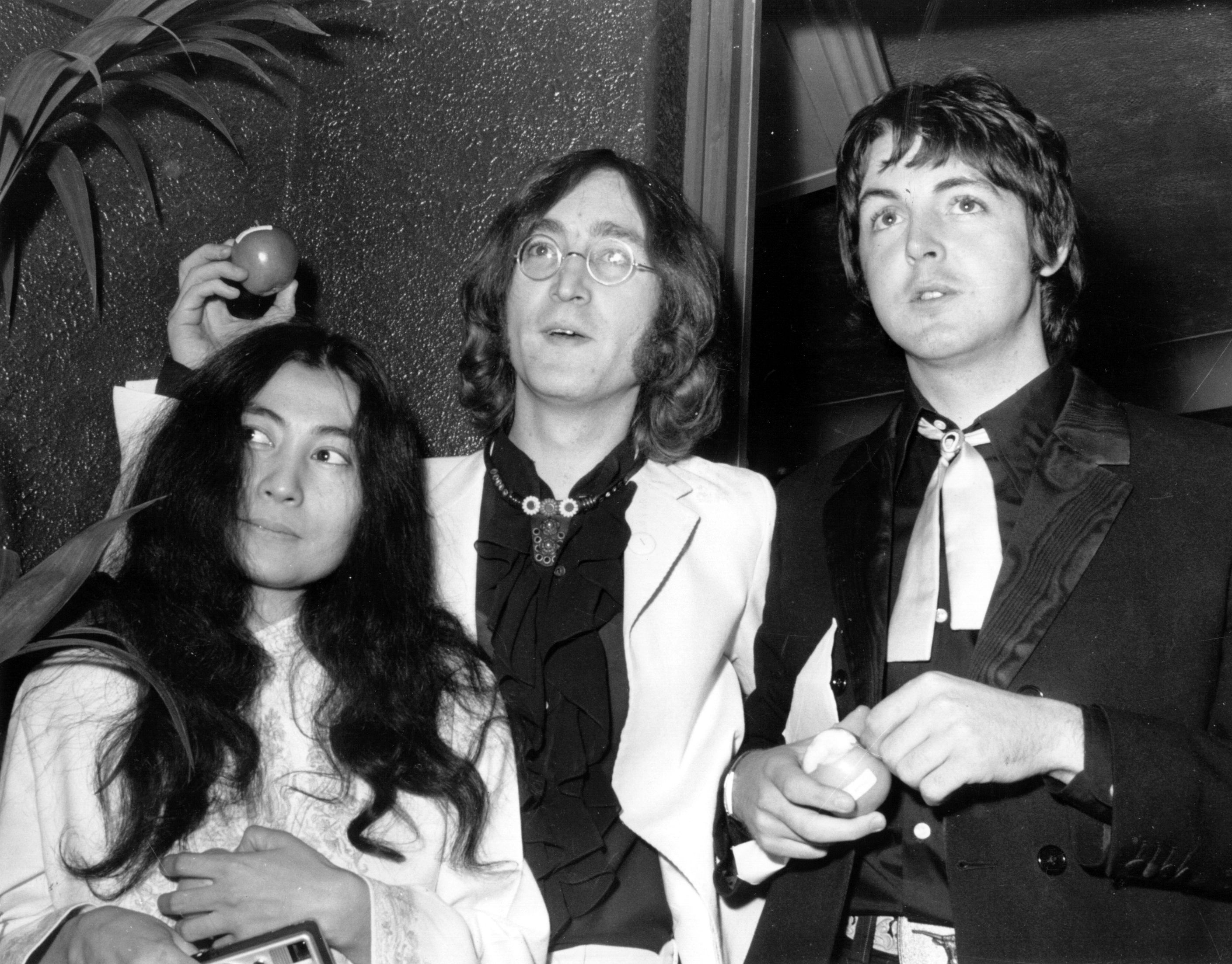 18th July 1968:  Beatle John Lennon (1940 - 1980) and his Japanese girlfriend Yoko Ono with Beatle Paul McCartney, right, ...