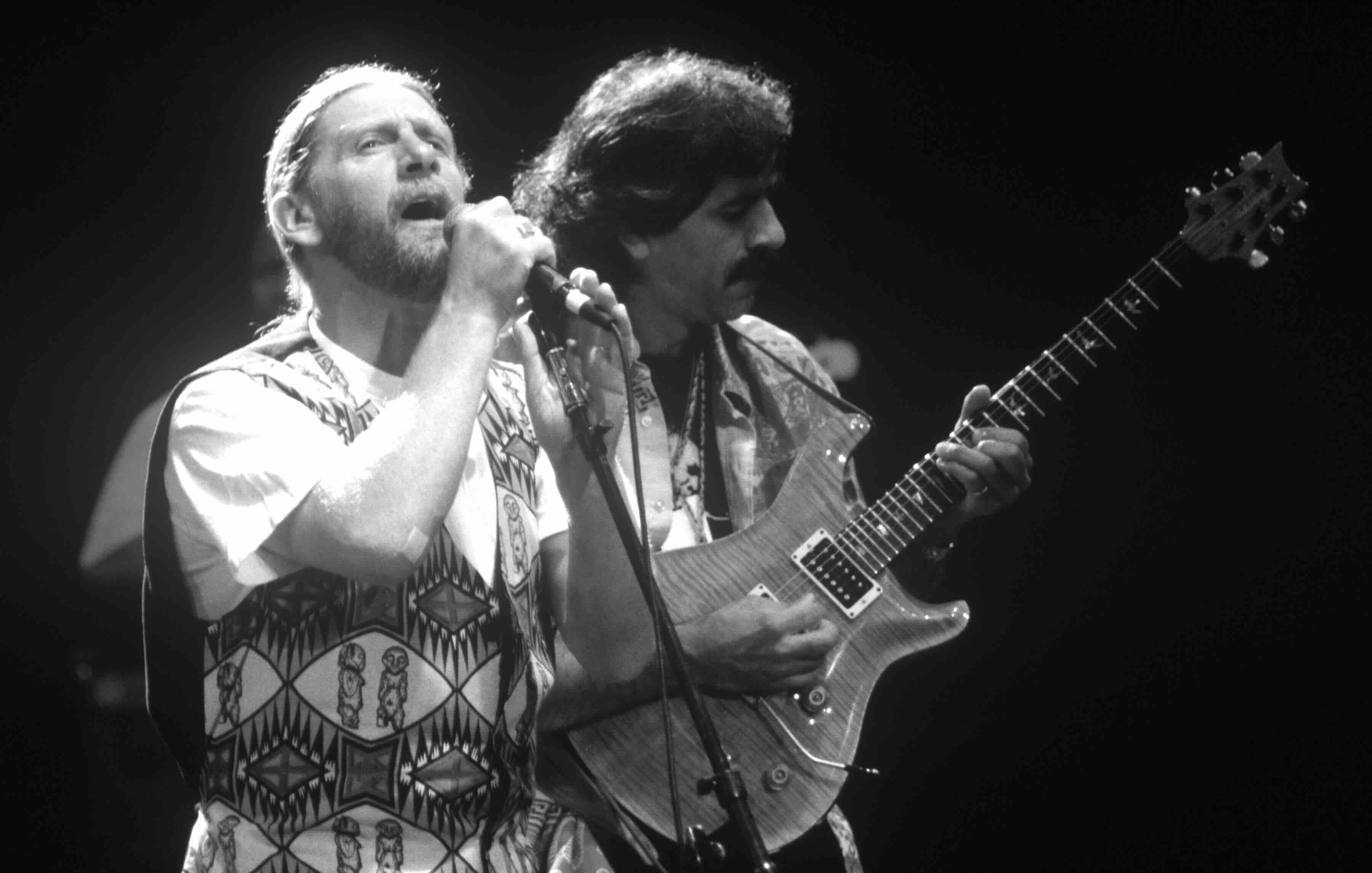 Alex Ligertwood (L) and Jorge Santana of Santana band perform at Shoreline Amphitheatre on October 9, 1993 in Mountain Vie...