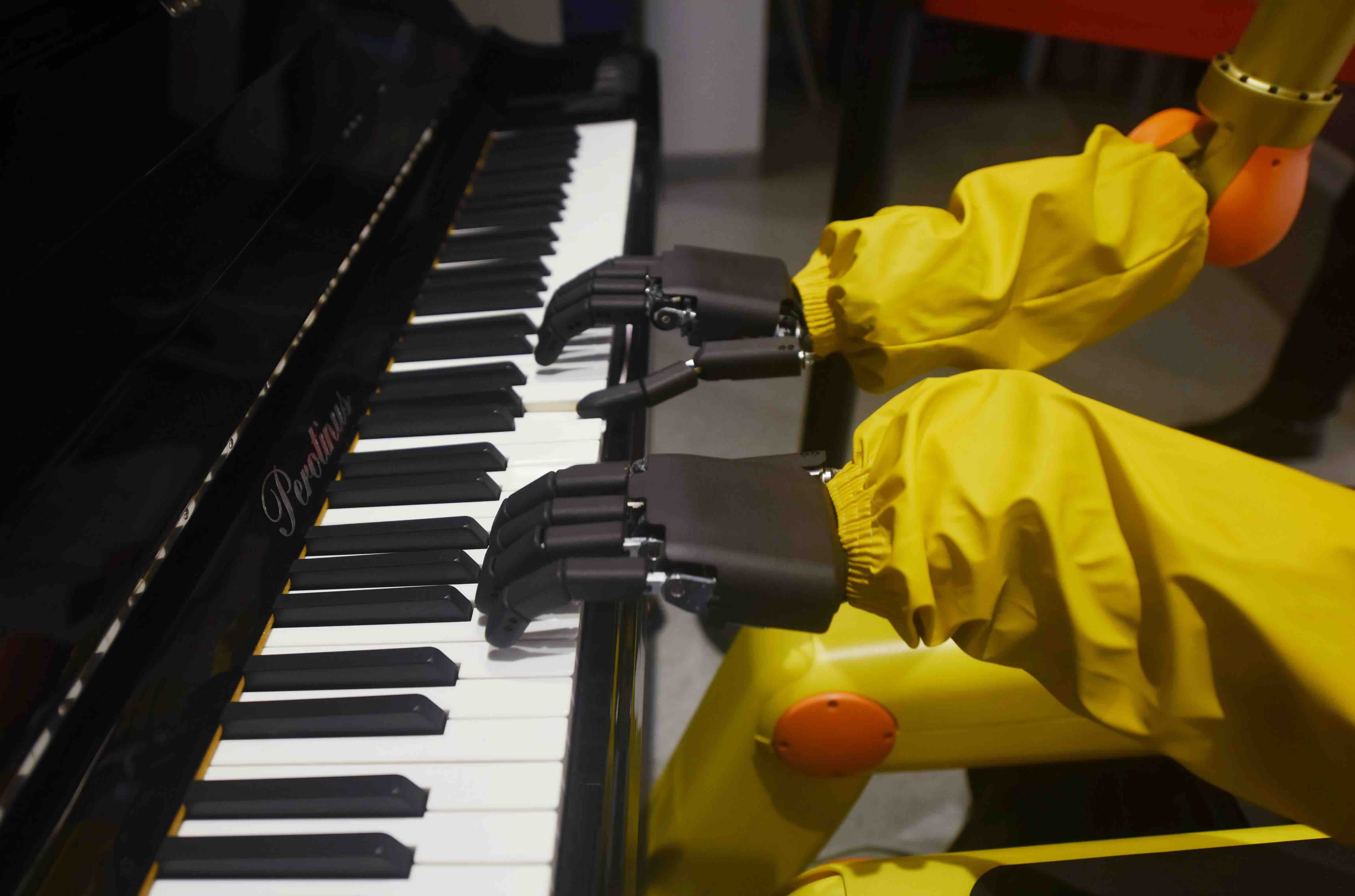 HANGZHOU, CHINA - DECEMBER 28: A humanoid robot plays piano at a restaurant on December 28, 2022 in Hangzhou, Zhejiang Pro...