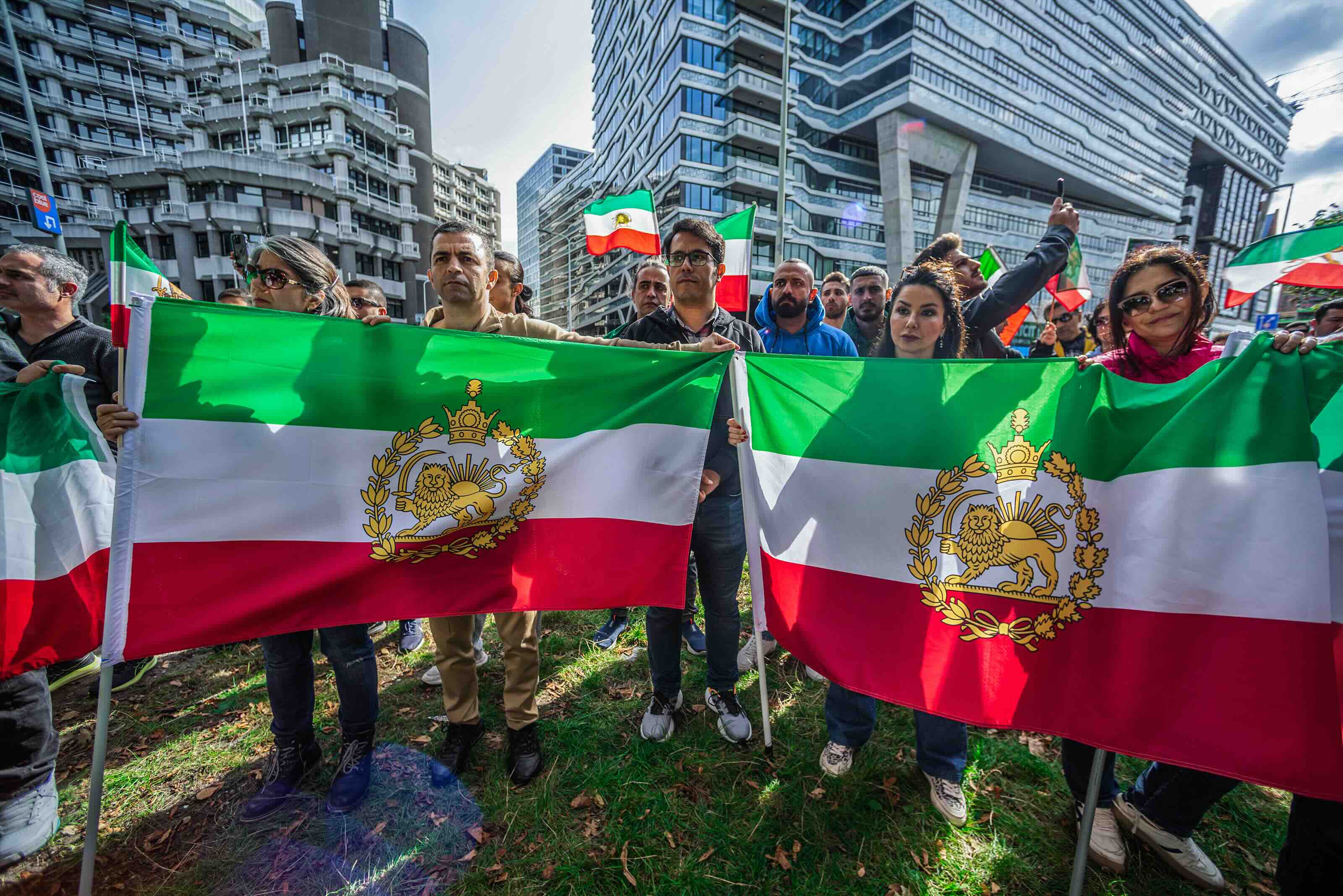 THE HAGUE, NETHERLANDS - 2024/09/14: Protesters hold flags during the commemoration. A small but vocal group of Iranians a...
