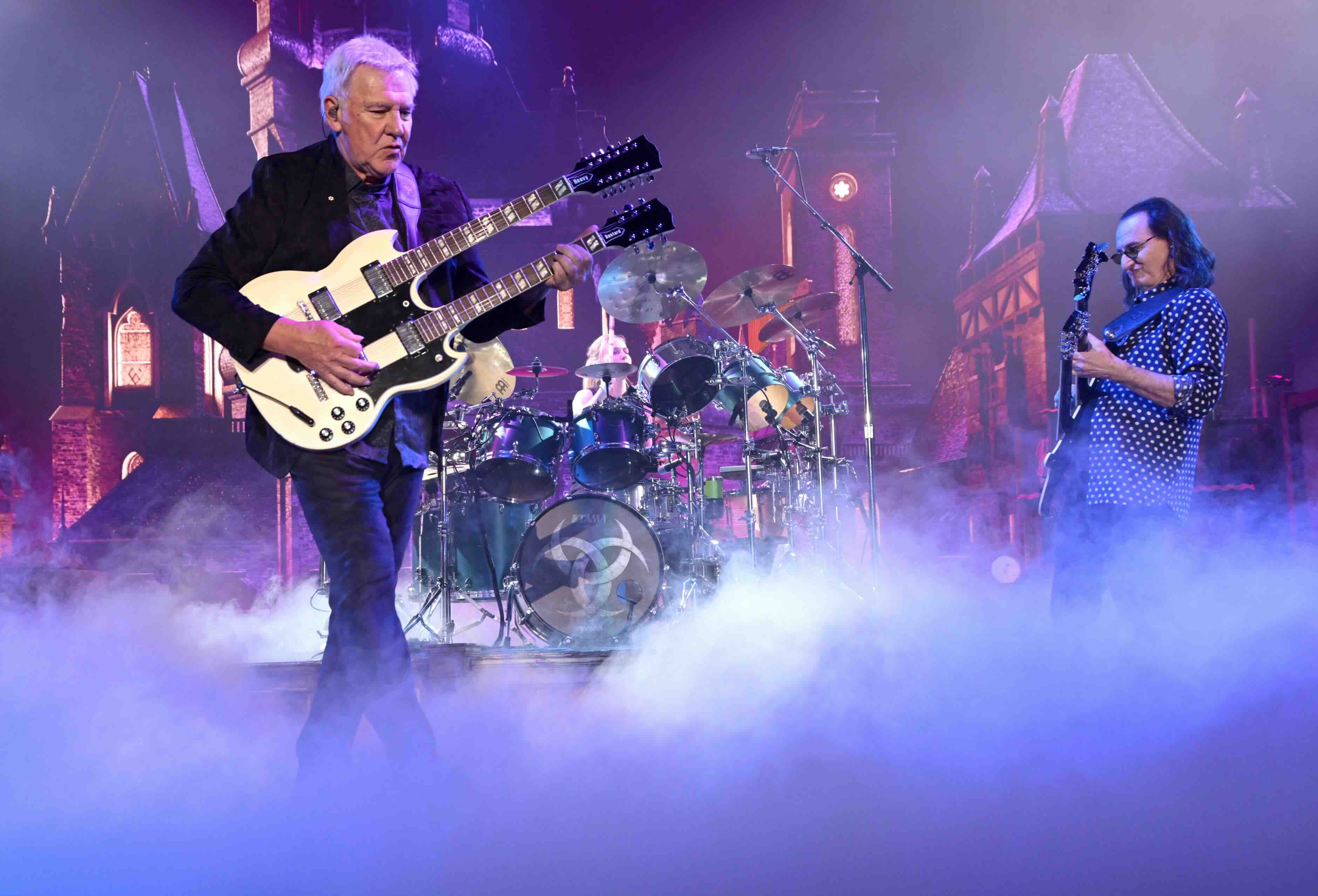 INGLEWOOD, CALIFORNIA - JUNE 07: (L-R) Alex Lifeson, Anika Nilles and Geddy Lee of Rush perform during the opening night o...