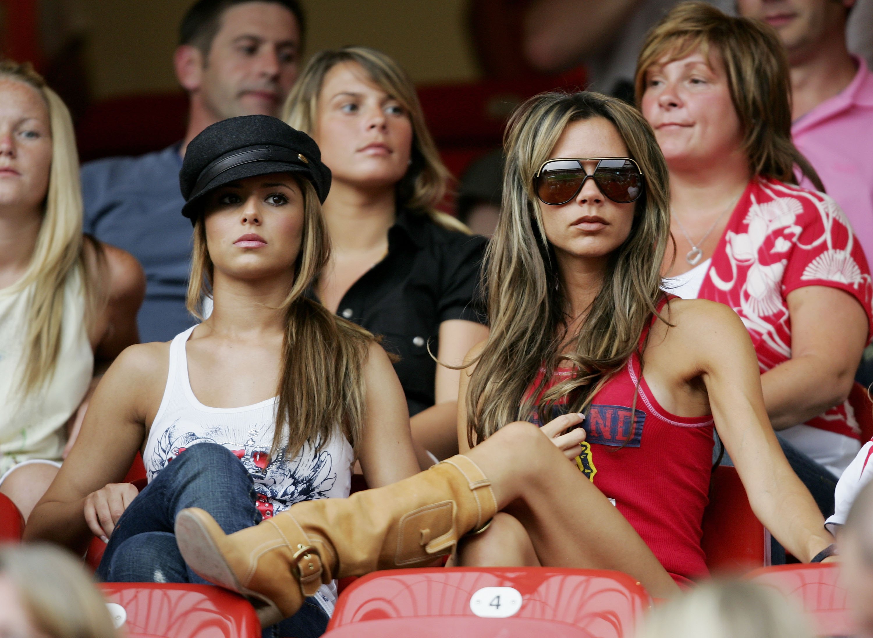 NUREMBERG, GERMANY - JUNE 15:  (L to R) Singer Cheryl Tweedy the girlfriend of Ashley Cole and Victoria Beckham the wife o...